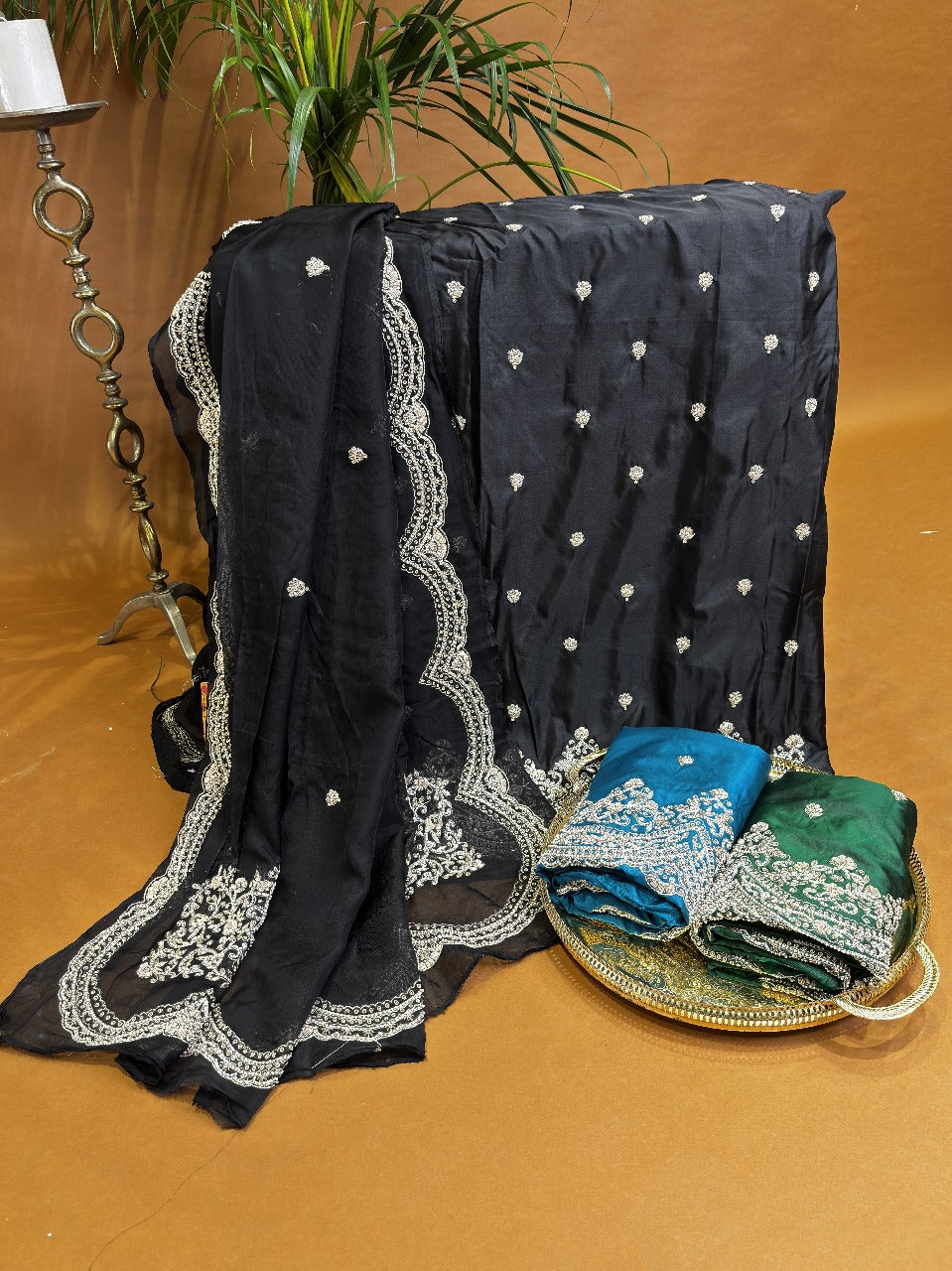 Black silk suit with silver works on dupatta