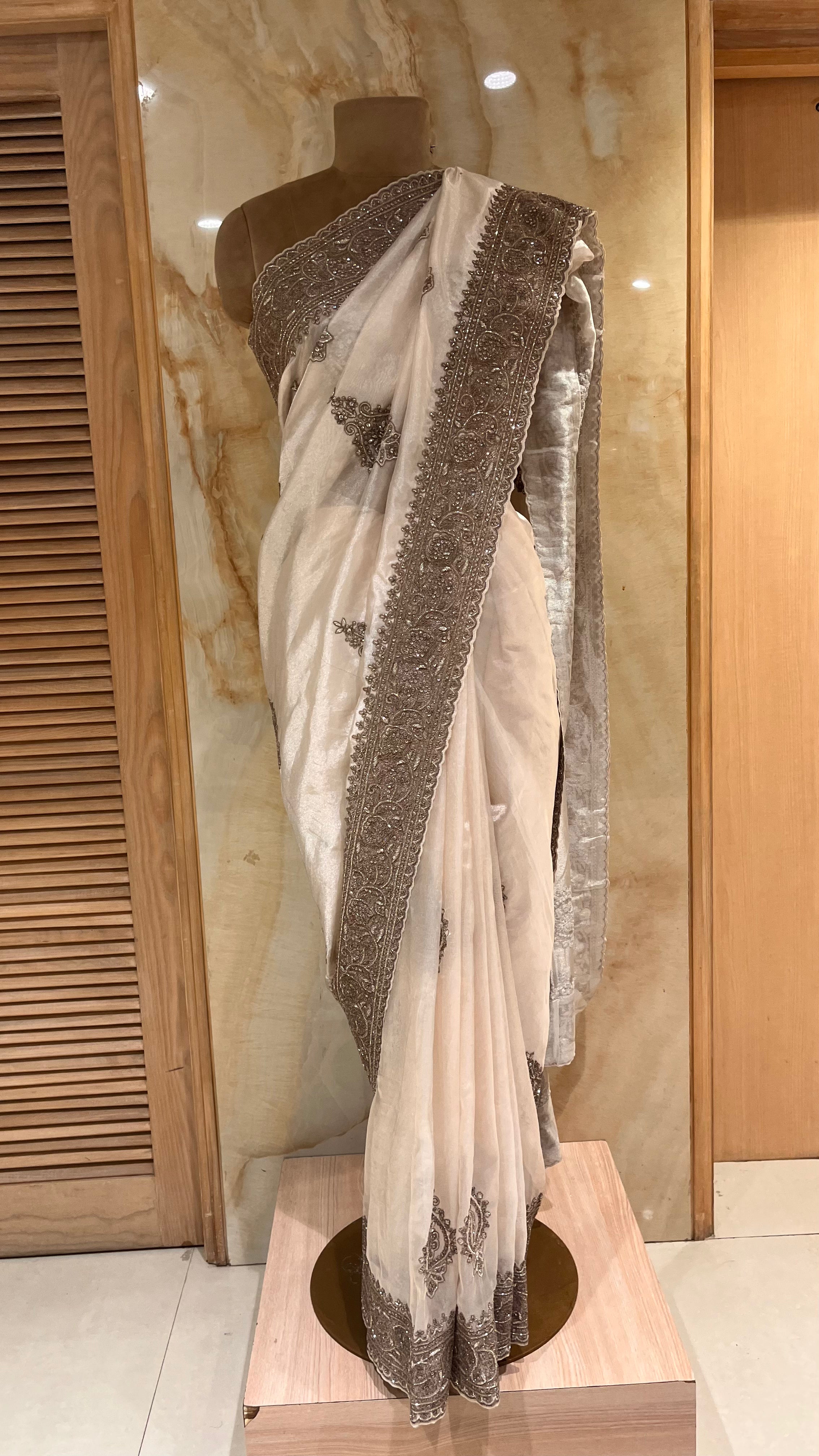 ELEGANT OFF-WHITE DESIGNER SAREE WITH HEAVY EMBROIDERED BORDER