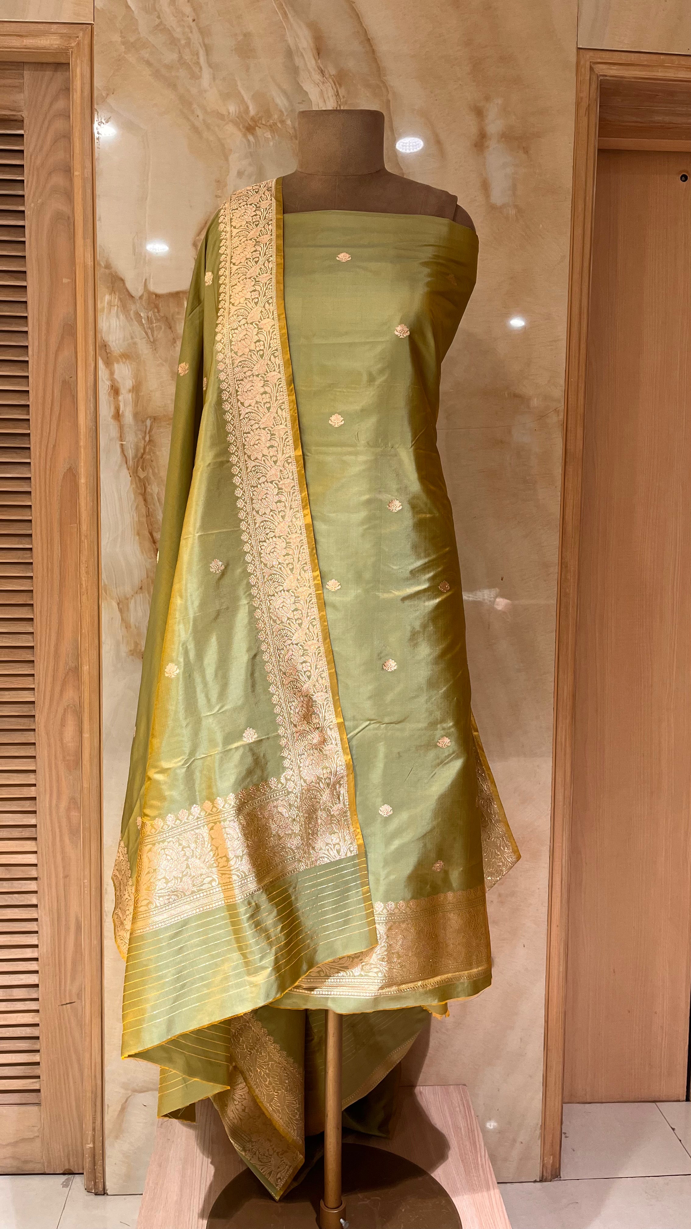 GRACEFUL OLIVE GREEN UNSTITCHED SUIT WITH RICH ZARI WORK