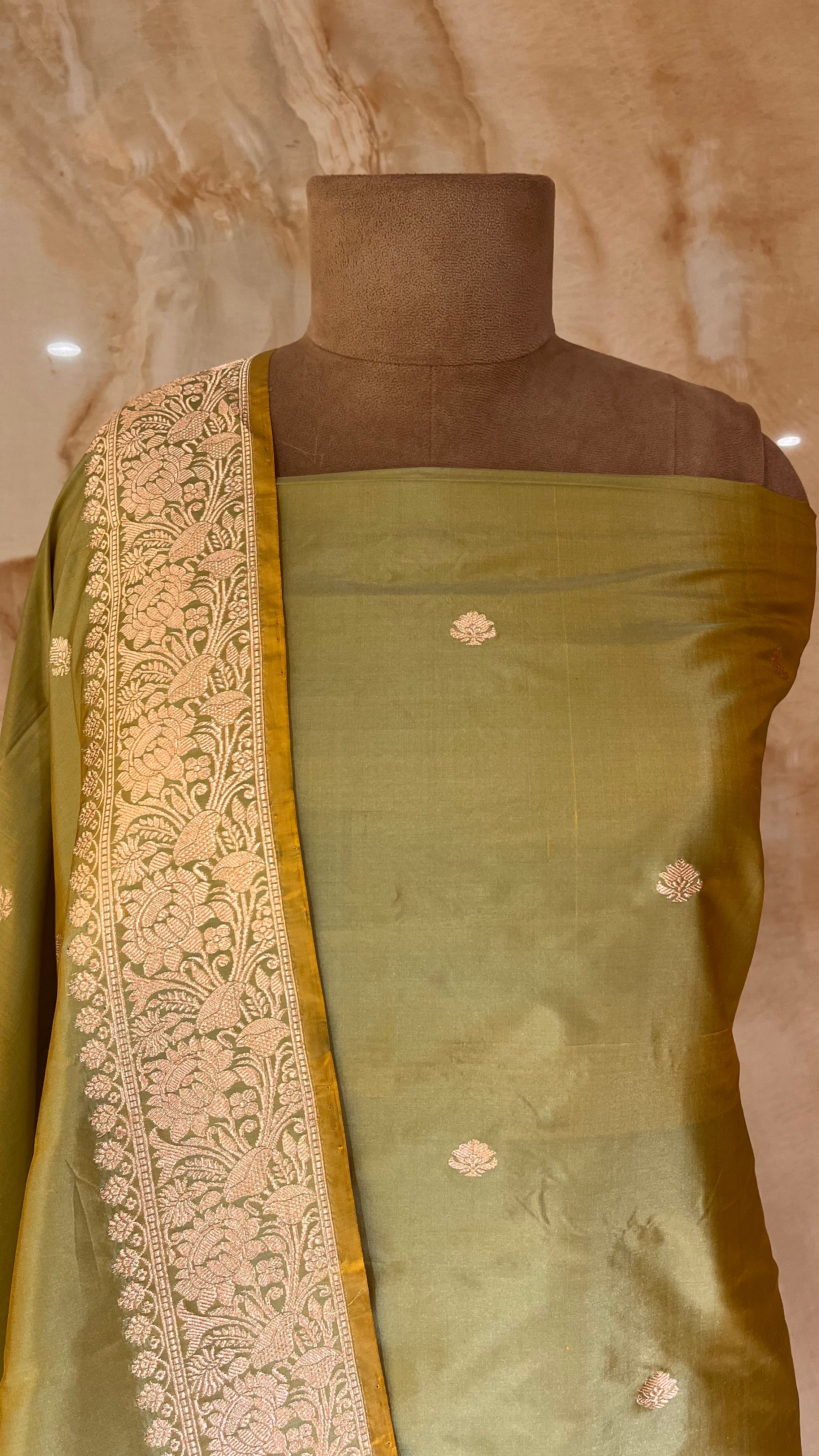 GRACEFUL OLIVE GREEN UNSTITCHED SUIT WITH RICH ZARI WORK
