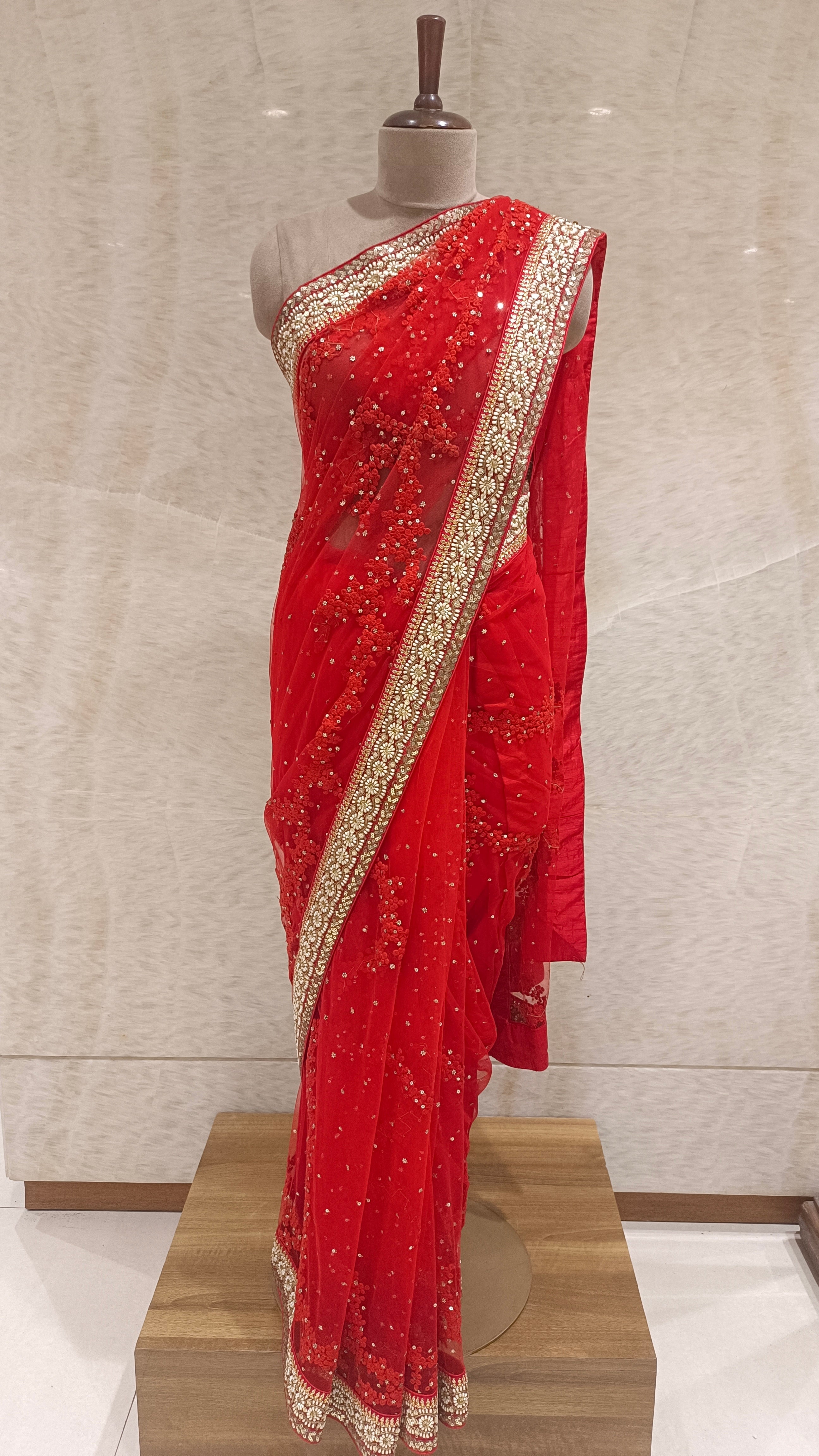 Red Net Saree with Dori, Sitara, Sequins, and Swarovski Embellishments