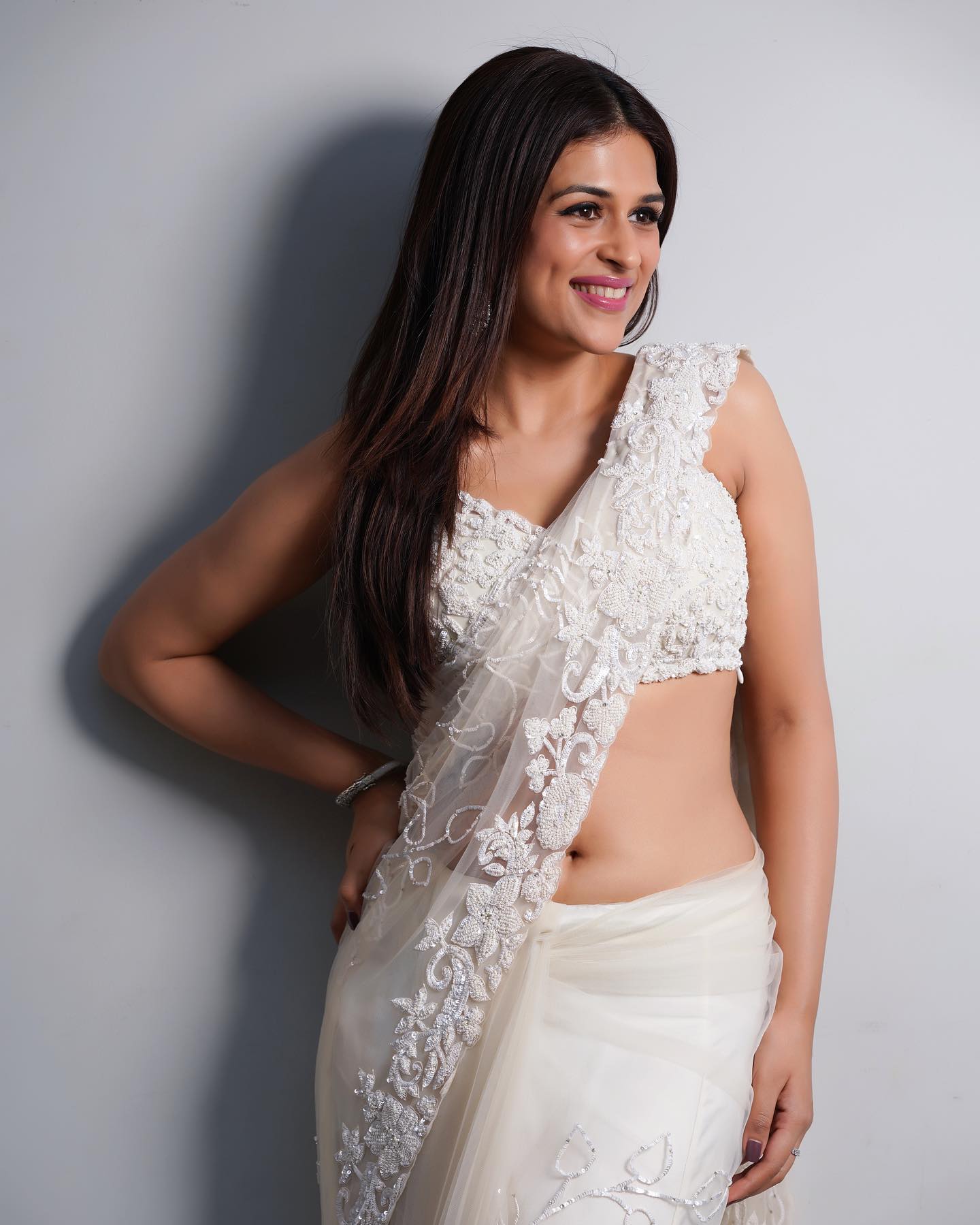 Ivory Net Saree with Sequin Work and Sleeveless Jaal Embroidered Blouse