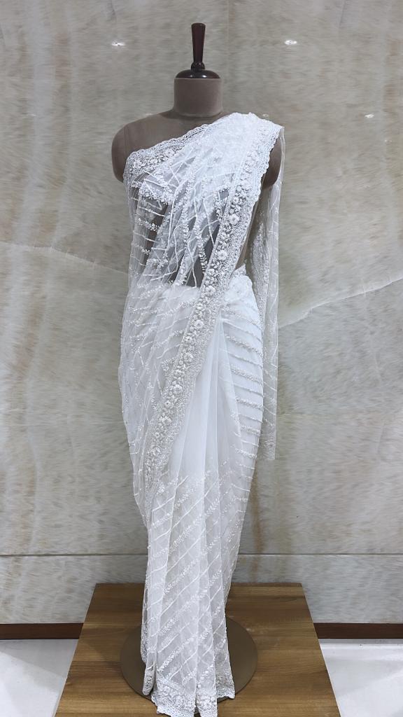 Ivory Net Saree with All-Over Sequin Embroidery and Unstitched Blouse