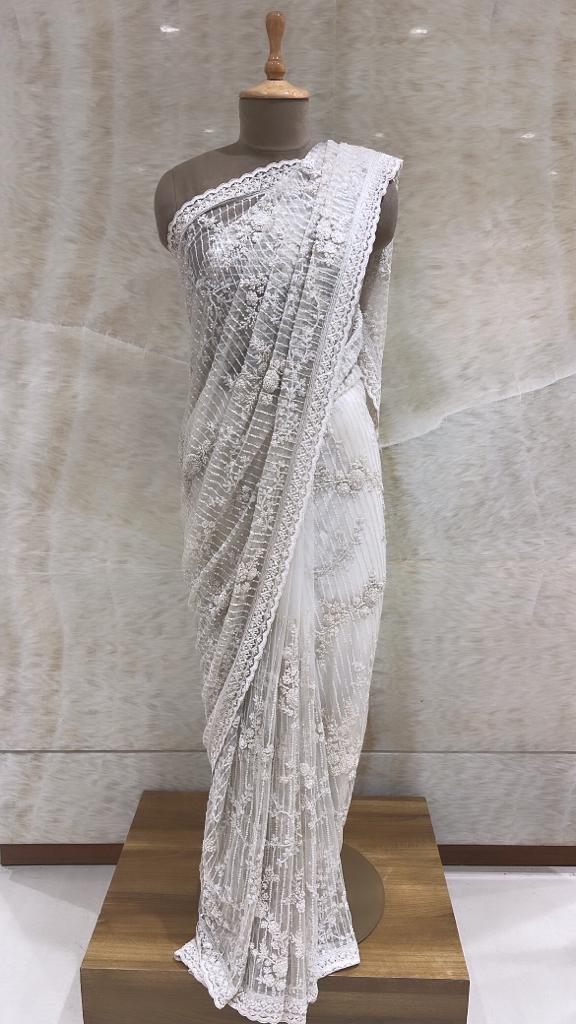 Ivory Net Saree with Detailed Sequin, Aari, and French Knot Embroidery and Unstitched Blouse