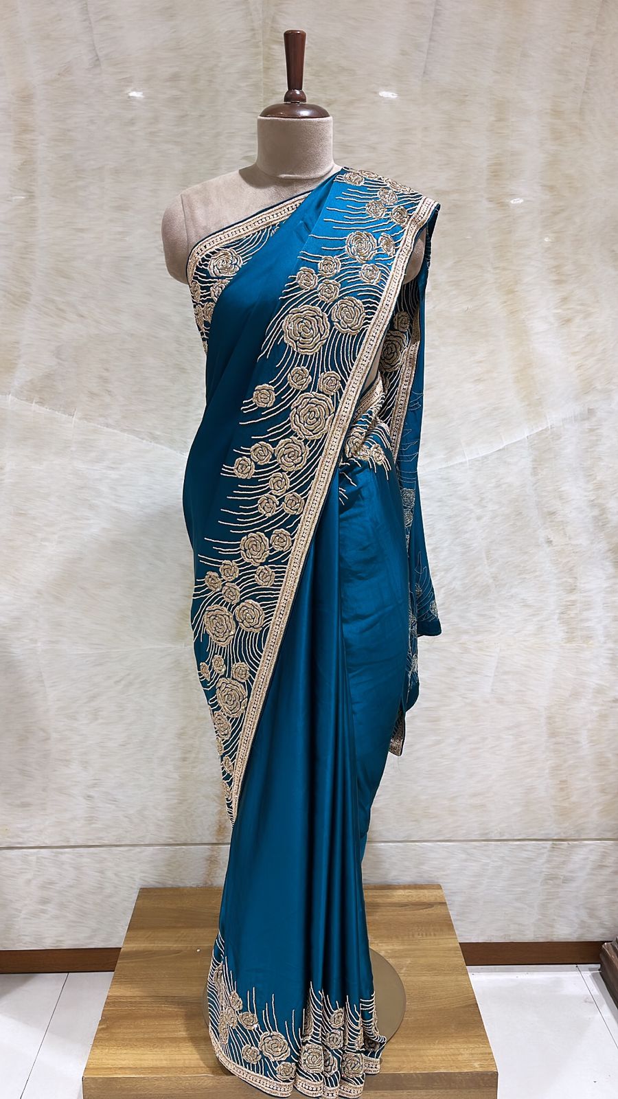 Timeless Elegance: Peacock Satin Saree with Pearls, Tilla, and Beads Embroidery