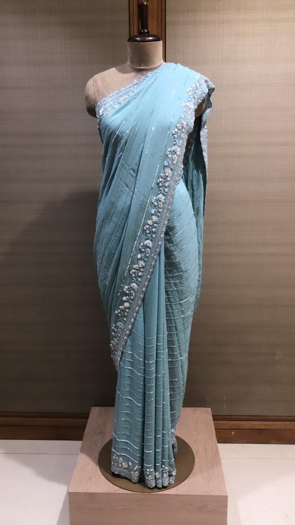 Elegant Turquoise Organza Saree: Sequins, Cut Dana, and Pearl Embroidery