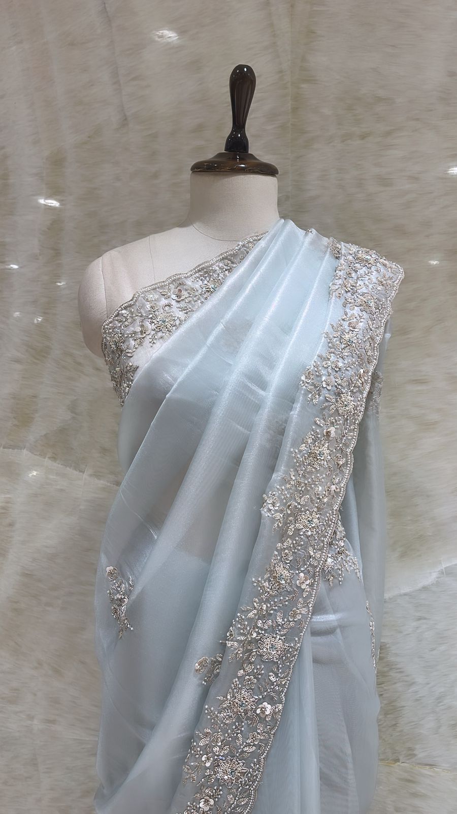 Love-in-Blue Organza Saree: Sky Blue and Floral Motifs with Elegant Embroidery