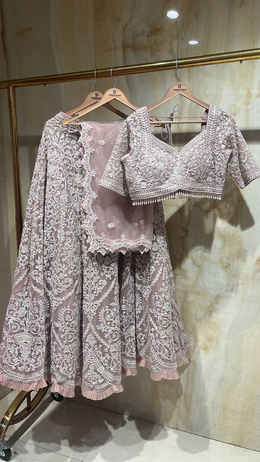 Intricate Tassels, Aari & Floral Embroidered Readymade Beige Lehnga Set.