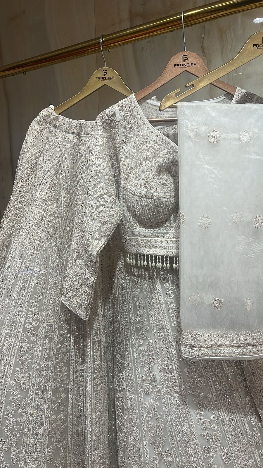 Sparkling Ivory Readymade Lehnga Choli Set Paired With Matching Dupatt