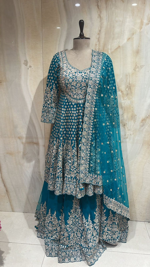 Enchanting Teal Blue Readymade Lehnga Paired With Matching Peplum Top & Organza Dupatta