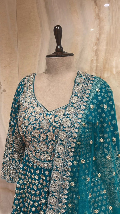 Enchanting Teal Blue Readymade Lehnga Paired With Matching Peplum Top & Organza Dupatta