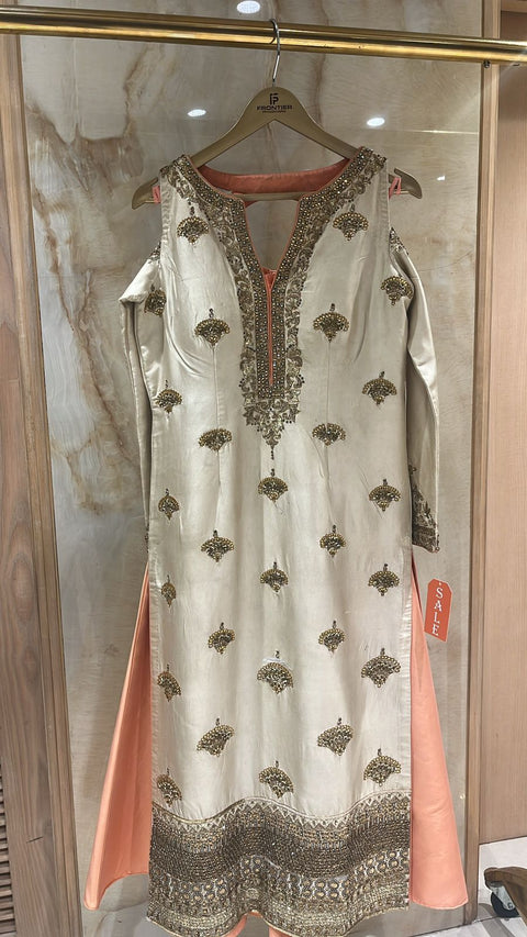 Sparkling Ivory Readymade Shrara Suit Paired With Contrast Bottom.