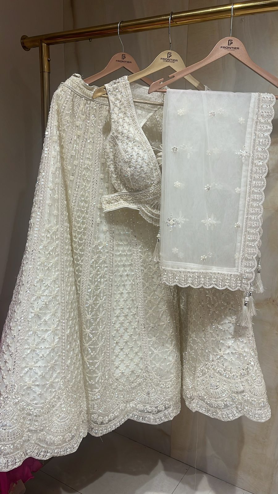 Sparkling Ivory Readymade Lehnga Set With Intricate Embellishment