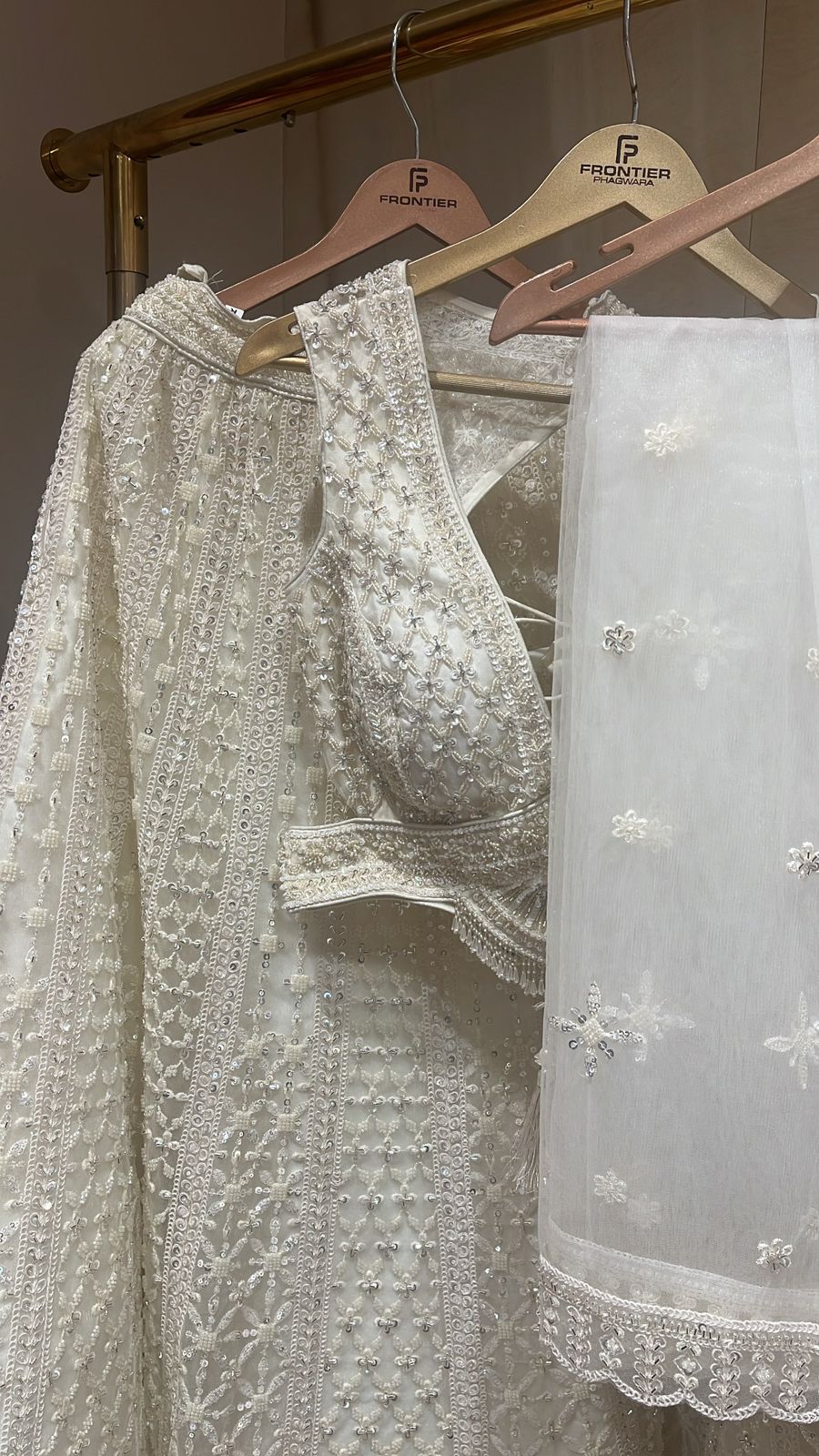 Sparkling Ivory Readymade Lehnga Set With Intricate Embellishment