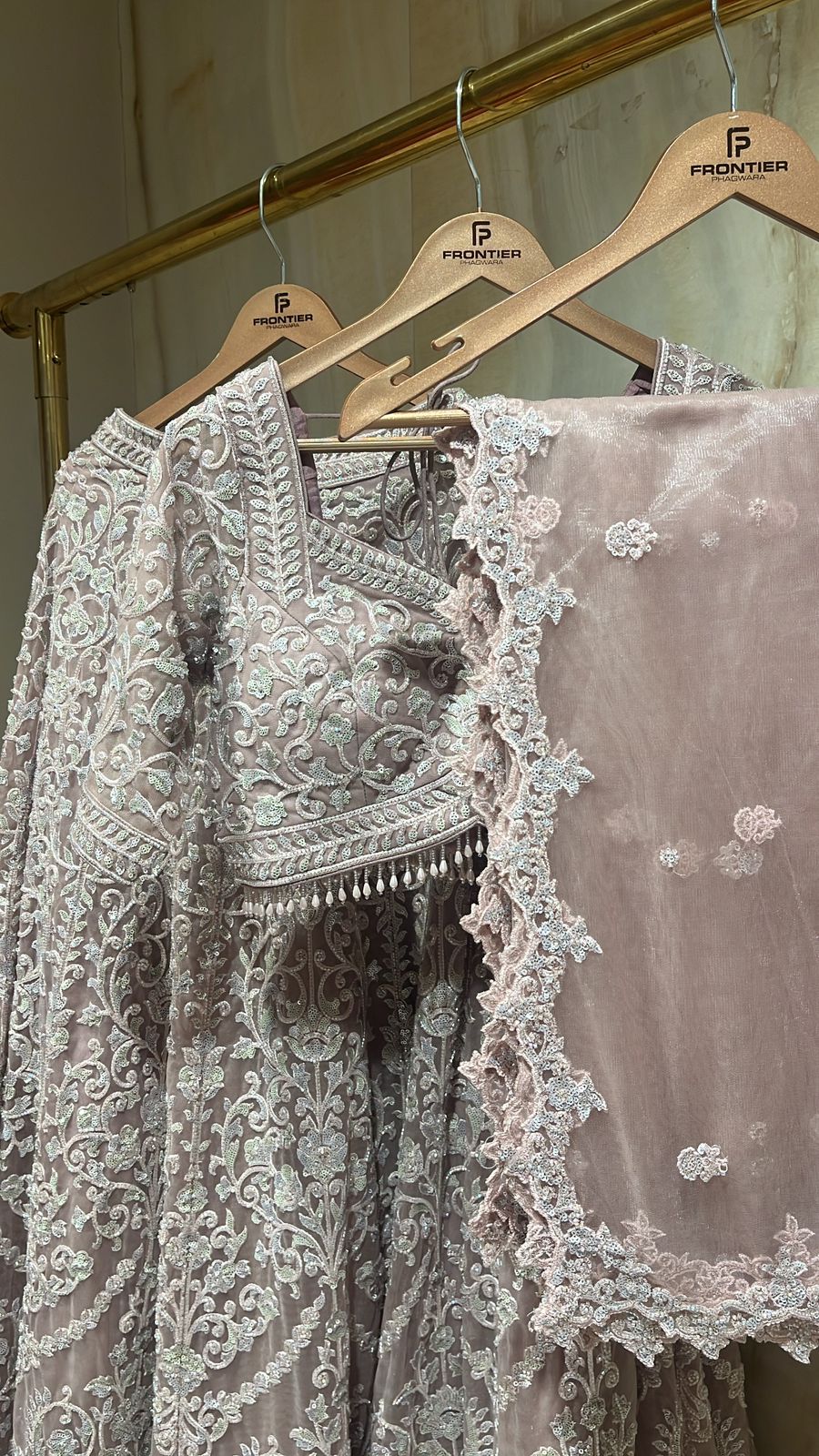 Intricate Tassels, Aari & Floral Embroidered Readymade Beige Lehnga Set.