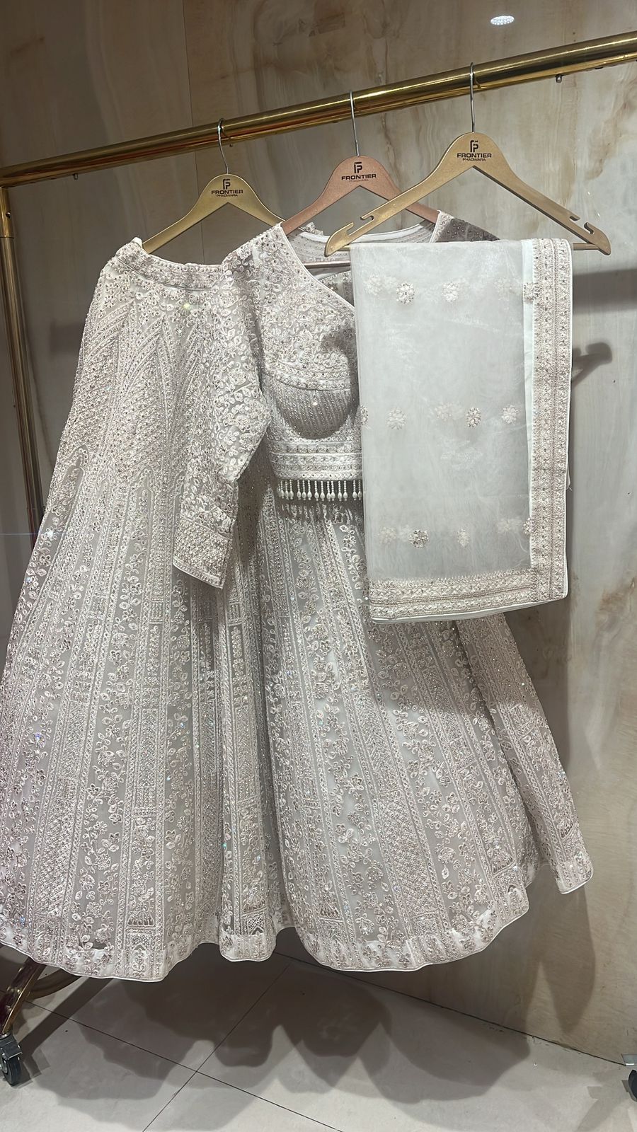 Sparkling Ivory Readymade Lehnga Choli Set Paired With Matching Dupatt