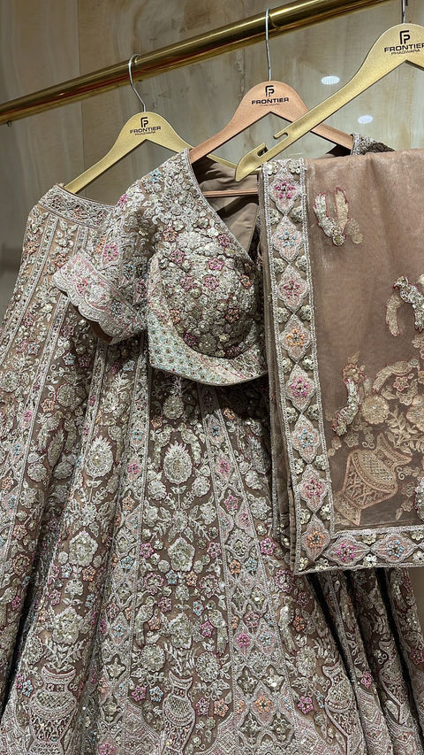 Graceful Taupe Shade Readymade Lehnga Choli Set Paired With Matching Embroidered Net Dupatta.