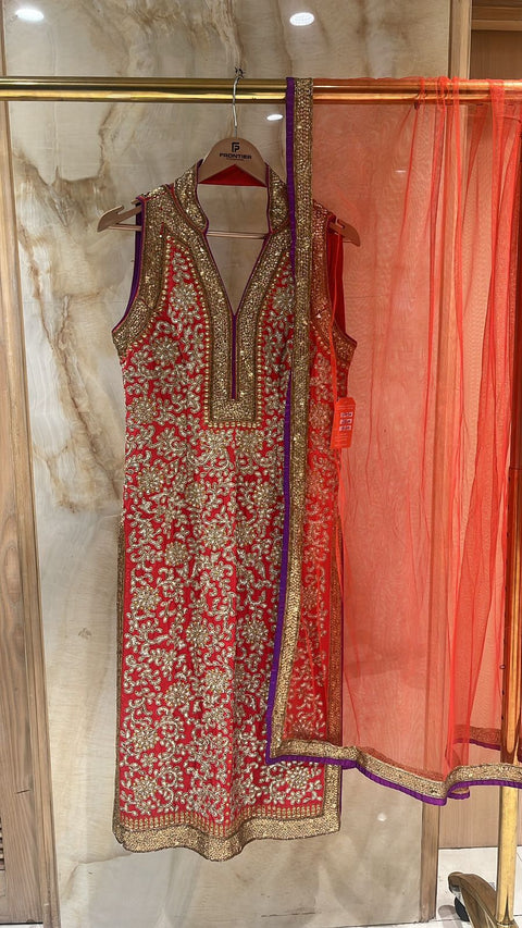 Sophisticated Red Pajami Suit Accompanied With Matching Net Dupatta.