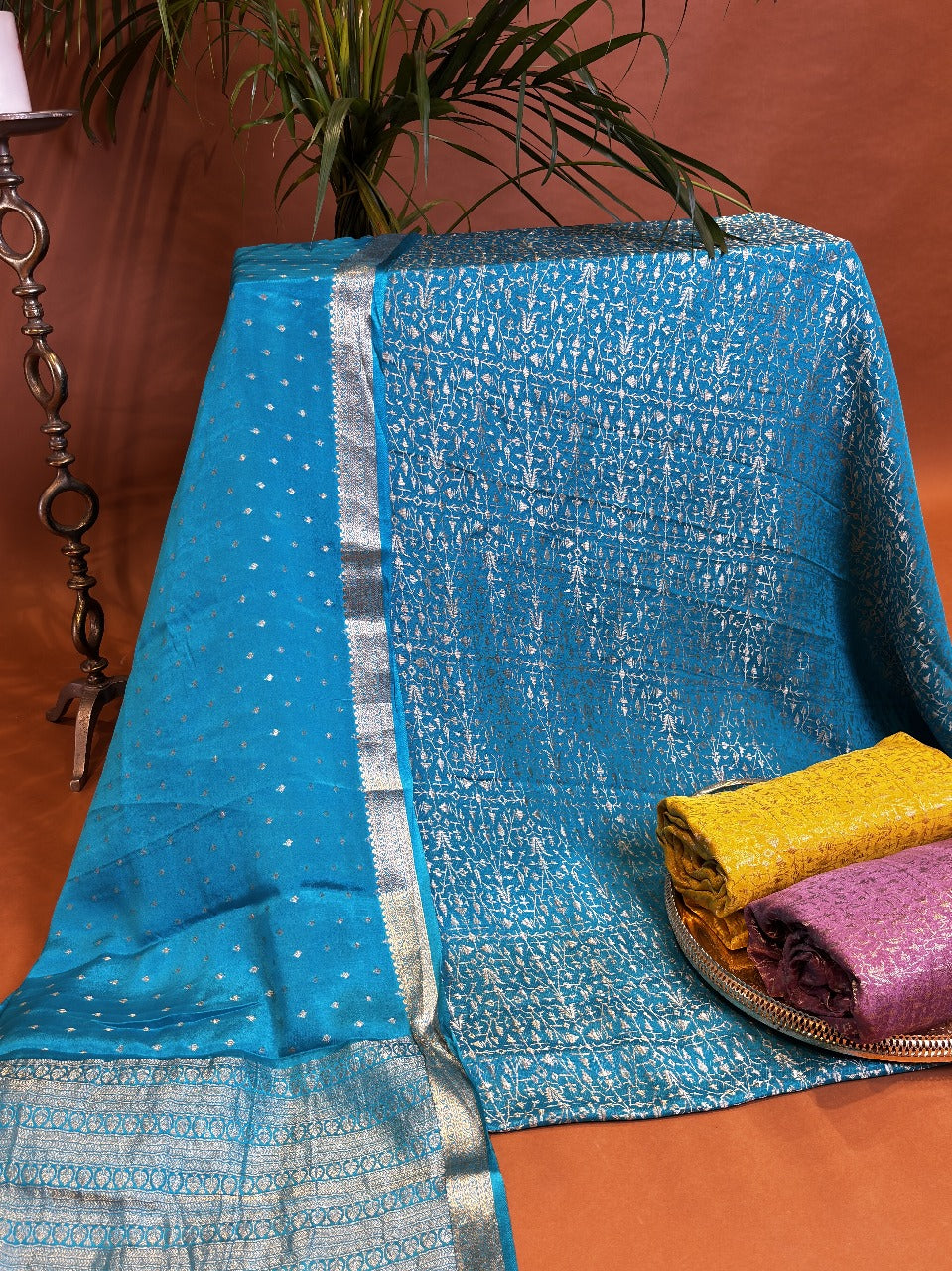 Turquoise silk fabric with intricate zari floral weaving