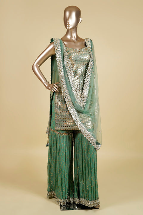 Green Sharara set embellished with mirror and Gotapatti work