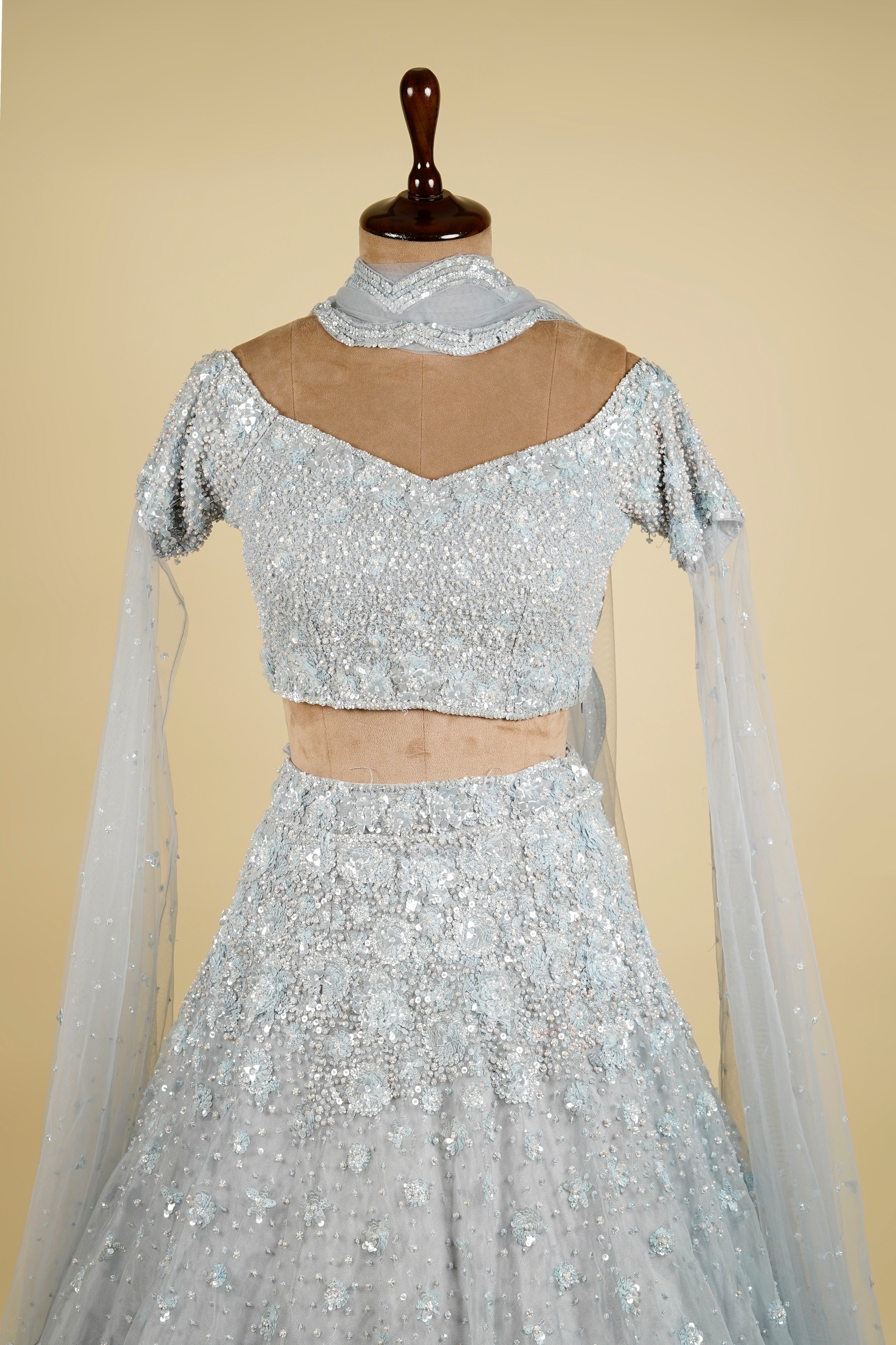 Cape Sleeve Lehenga Choli embellished with Sequin and Bead work