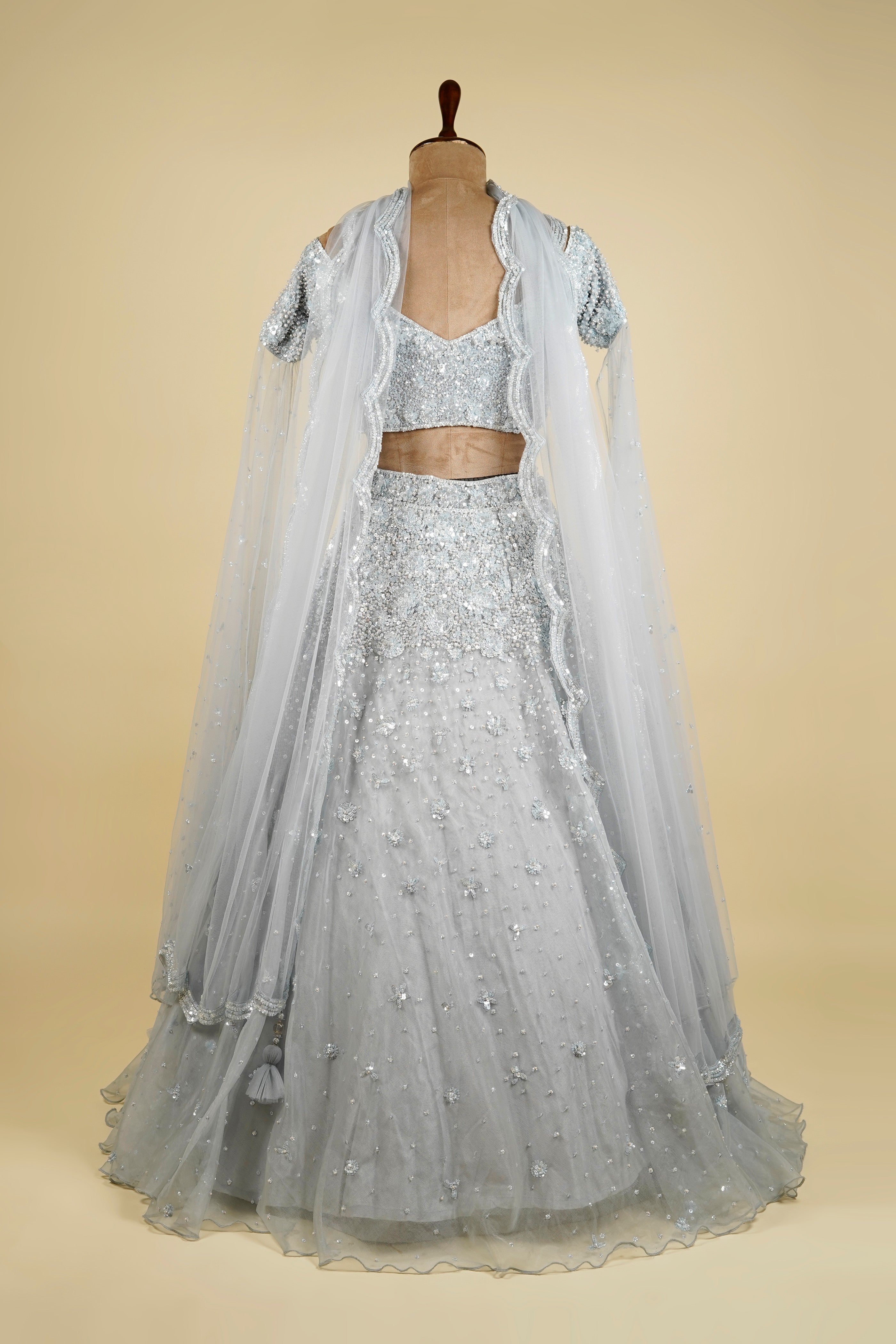 Cape Sleeve Lehenga Choli embellished with Sequin and Bead work