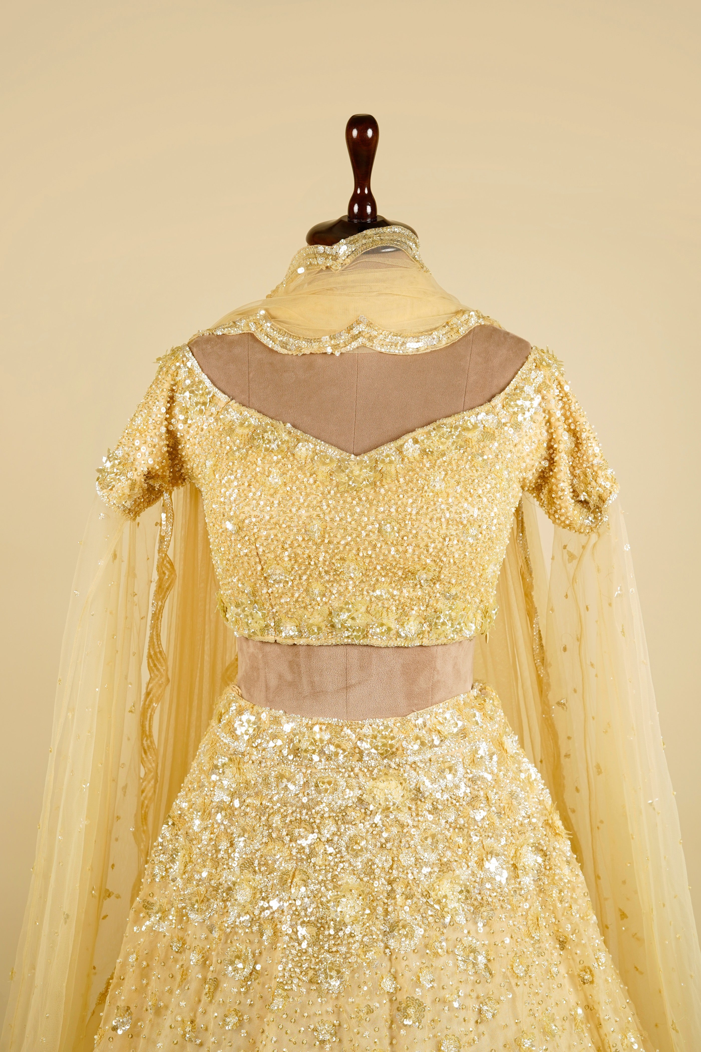 Cape Sleeve Lehenga Choli embellished with Sequin and Bead work