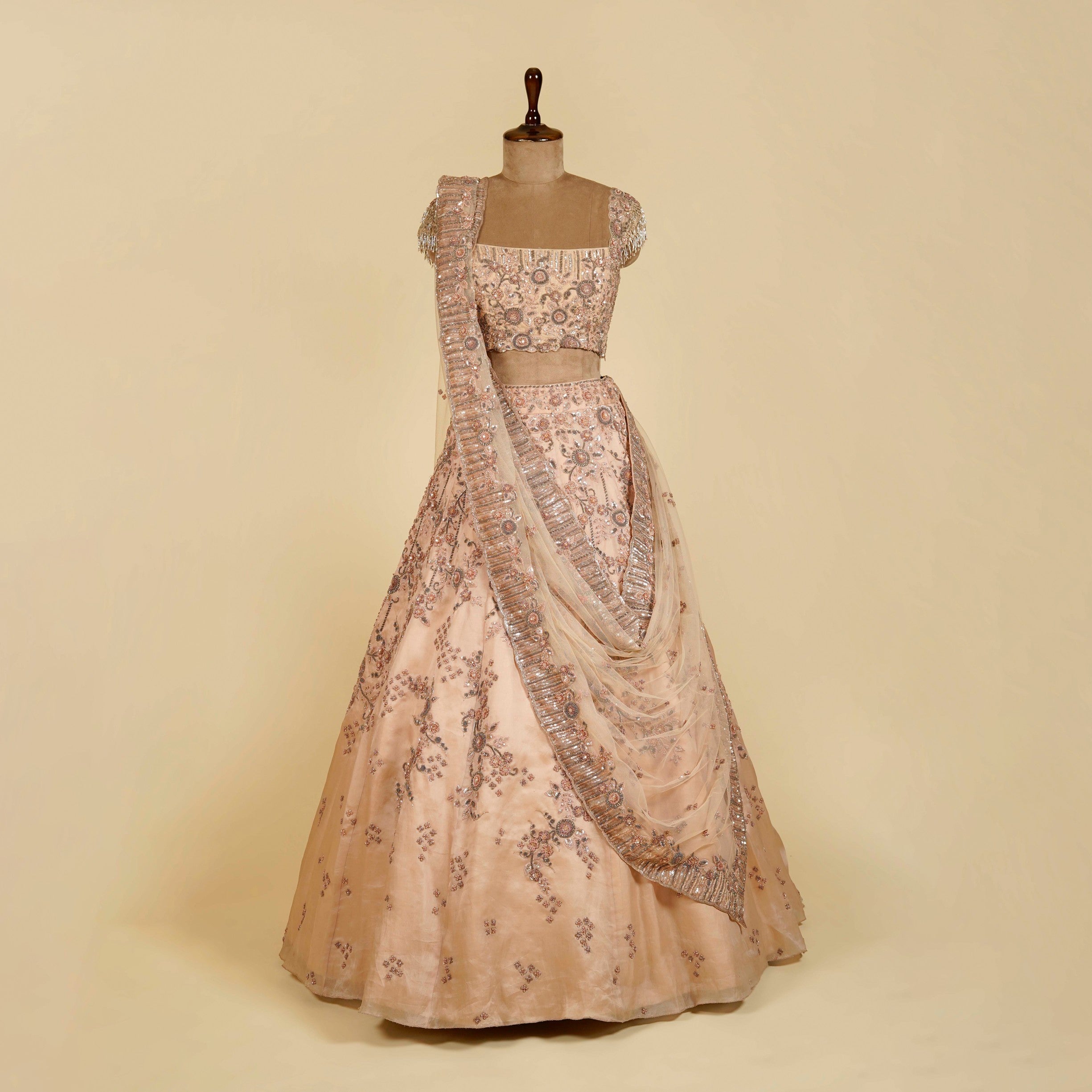 Dusty Peach Lehenga Choli embellished with Sequins, Thread and Cut dana work