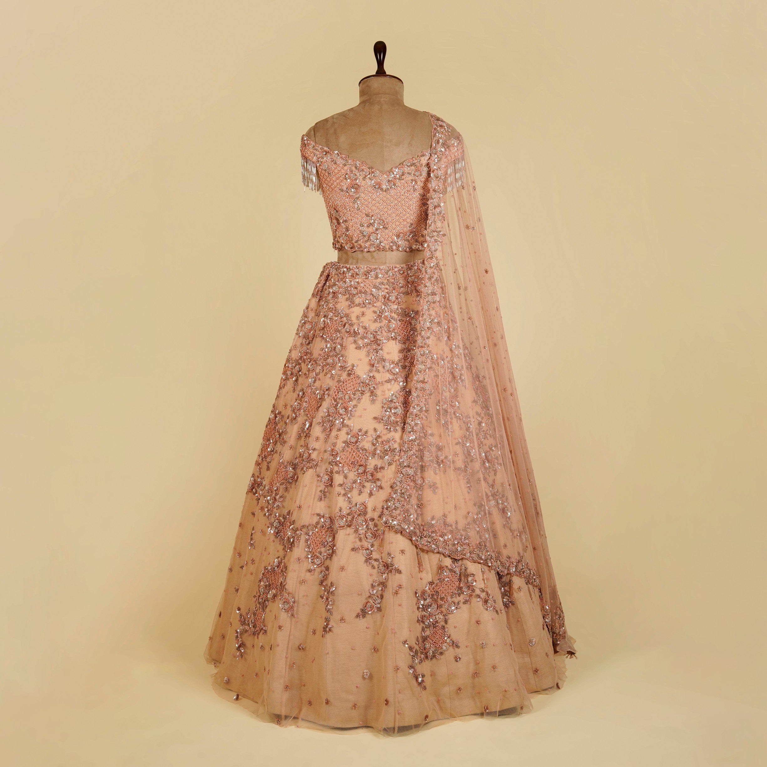 Peach Lehenga Choli embellished with Sequins and Cut dana work