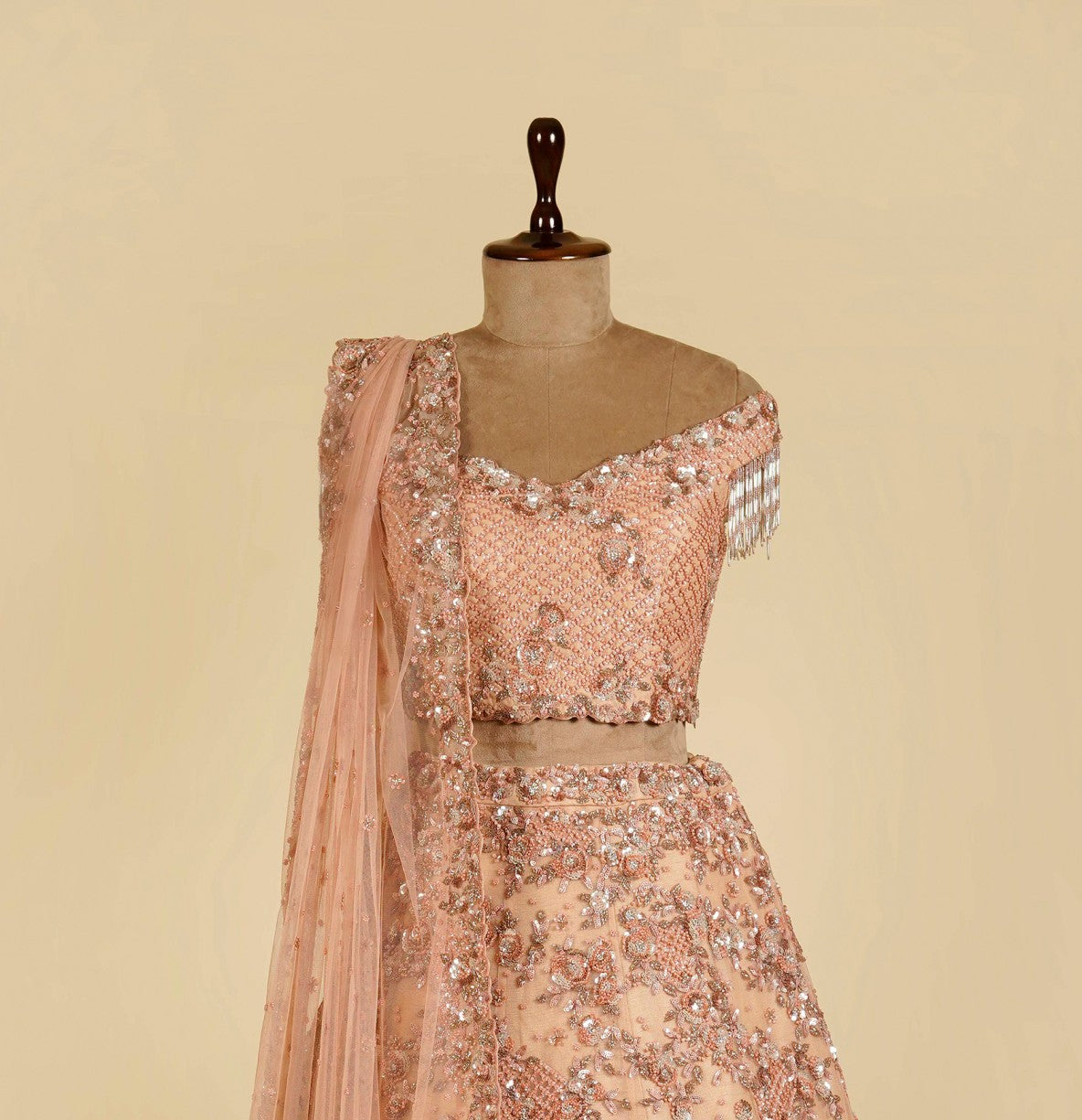 Peach Lehenga Choli embellished with Sequins and Cut dana work