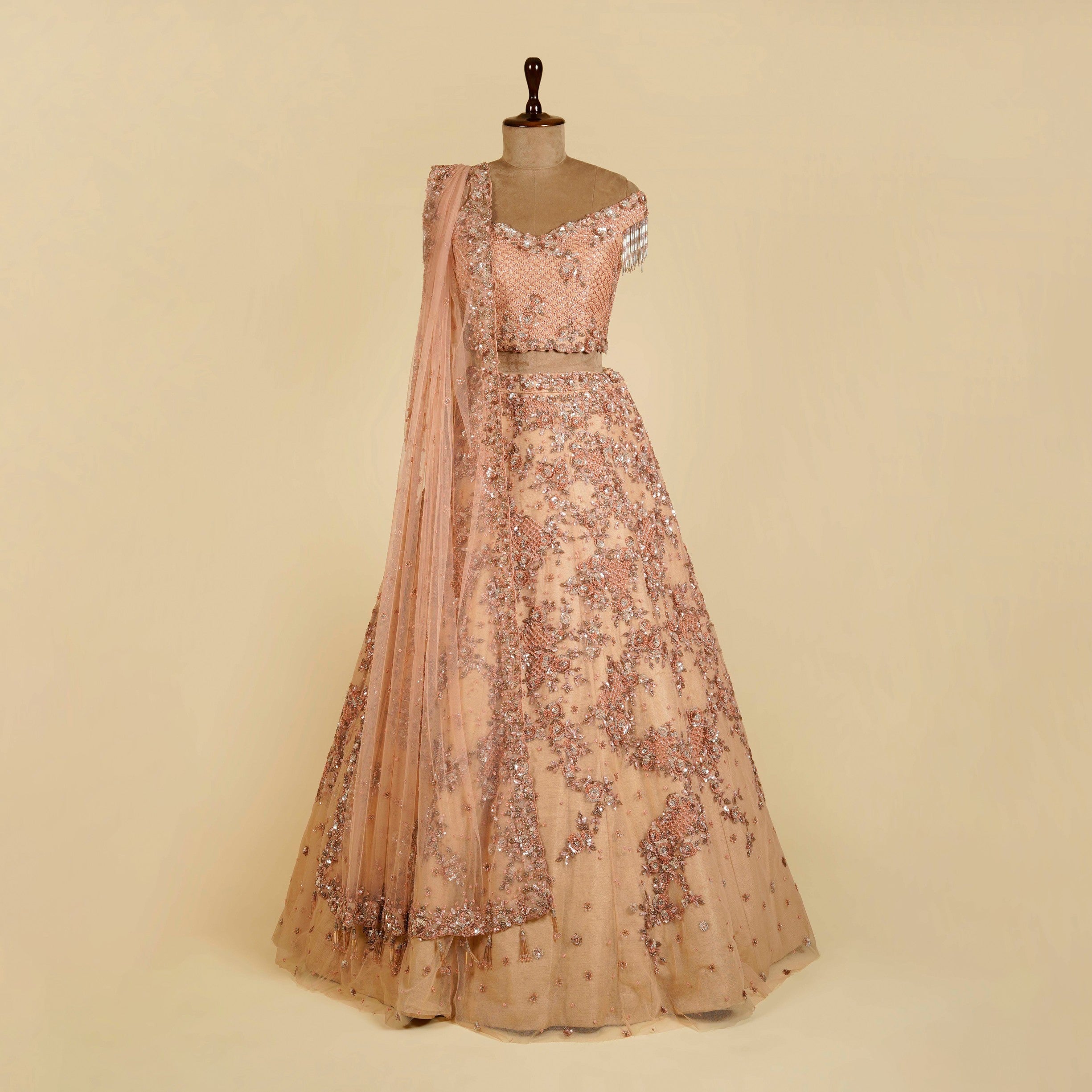 Peach Lehenga Choli embellished with Sequins and Cut dana work
