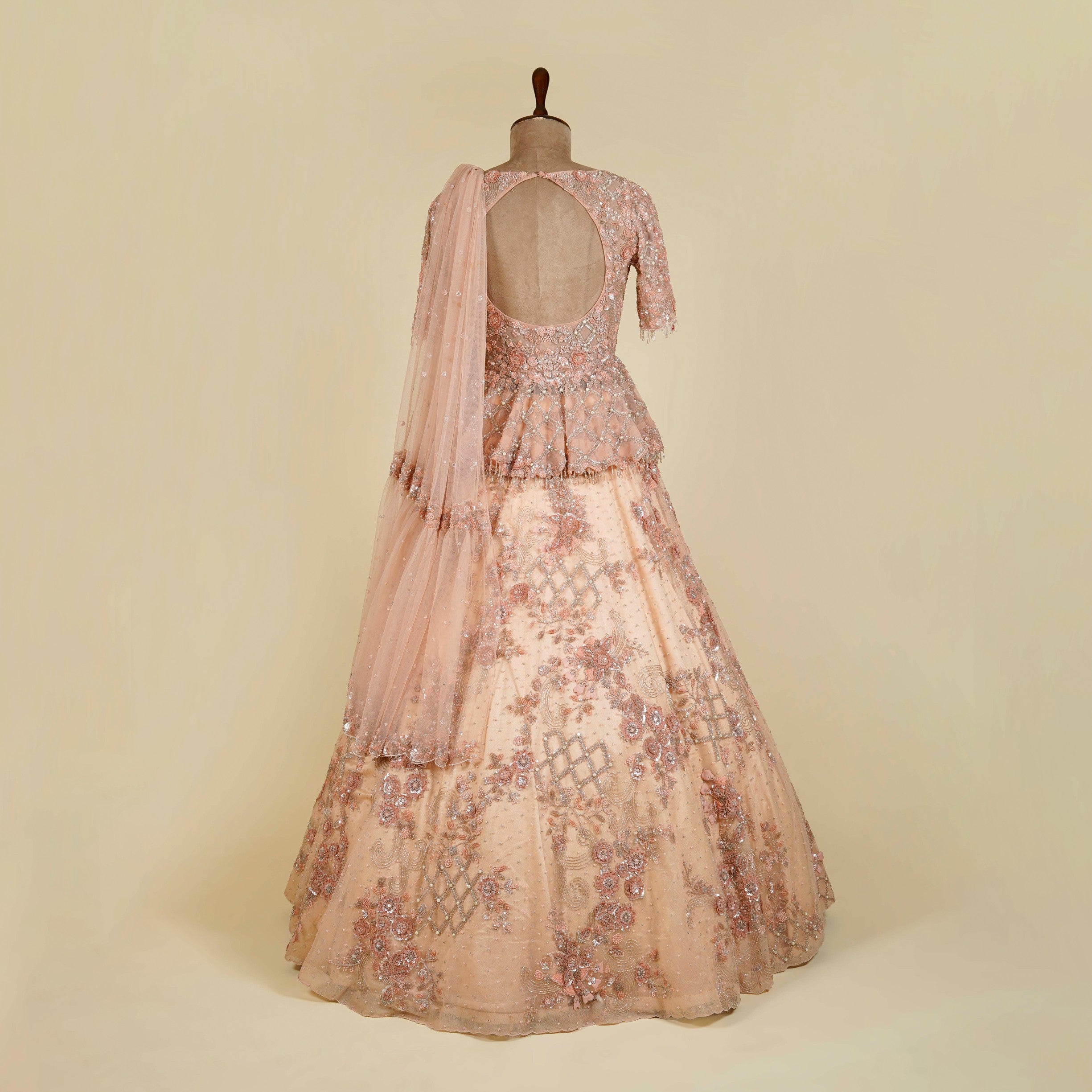 Peach Lehenga Choli embellished with Sequins and Cut dana work