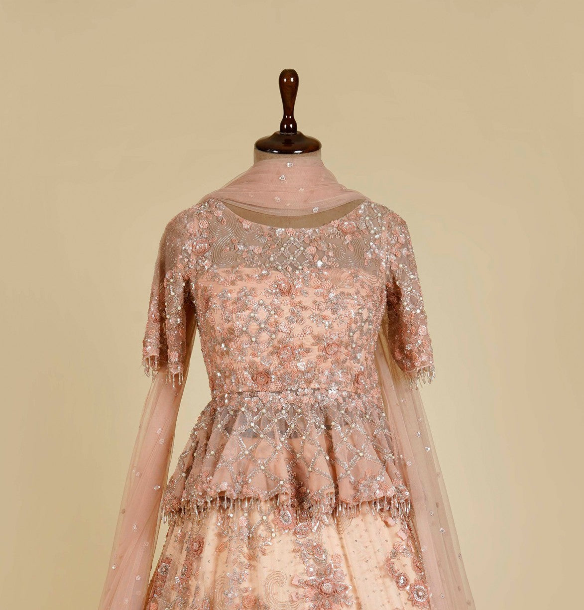 Peach Lehenga Choli embellished with Sequins and Cut dana work