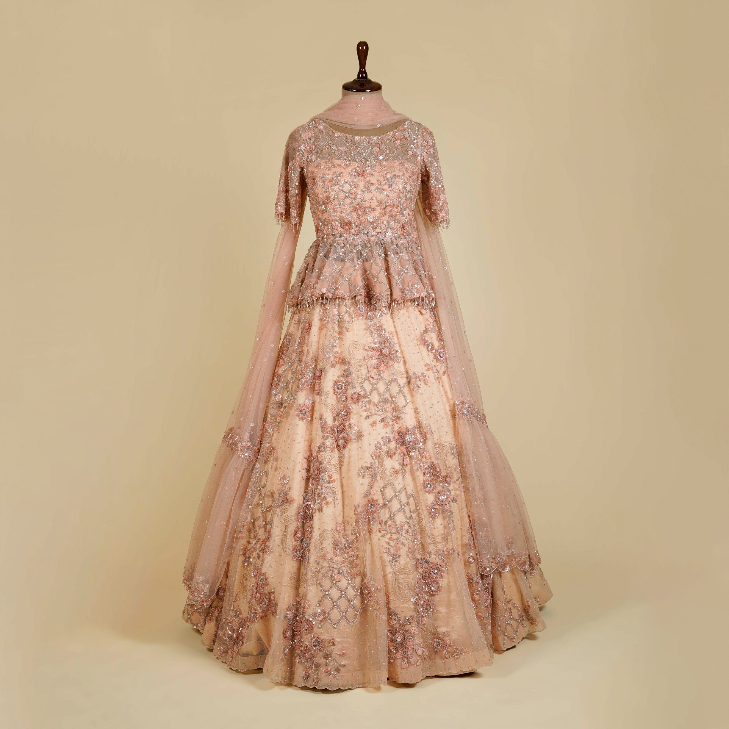 Peach Lehenga Choli embellished with Sequins and Cut dana work