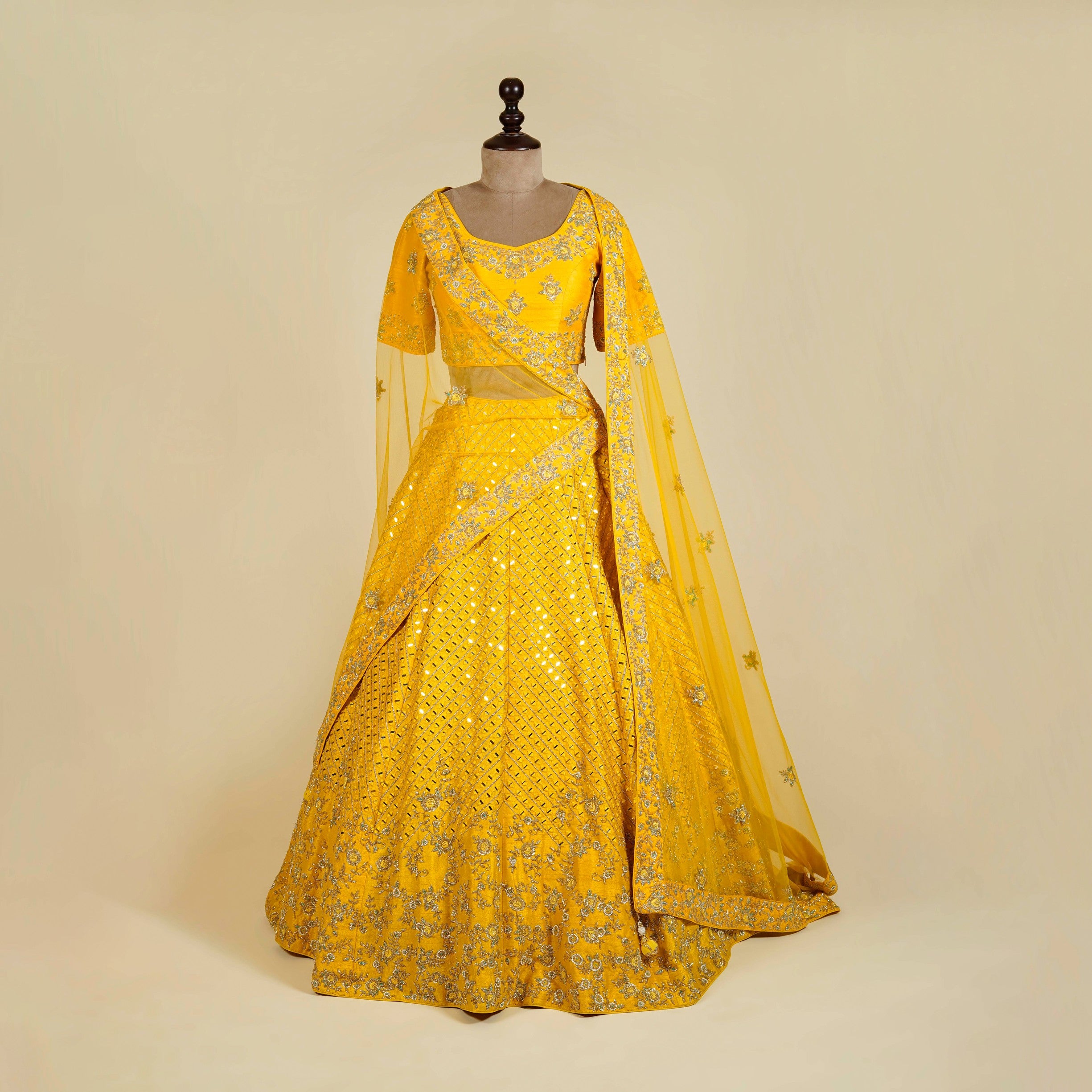 Yellow Lehenga Choli embellished with Mirror, Cut Dana and Pearl work