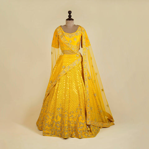 Yellow Lehenga Choli embellished with Mirror, Cut Dana and Pearl work