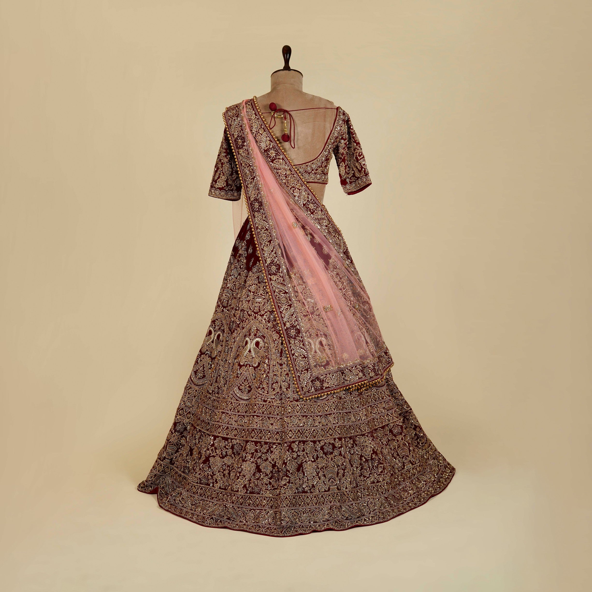 Maroon Lehenga Choli embellished with Dabka, Stone and antique hand work