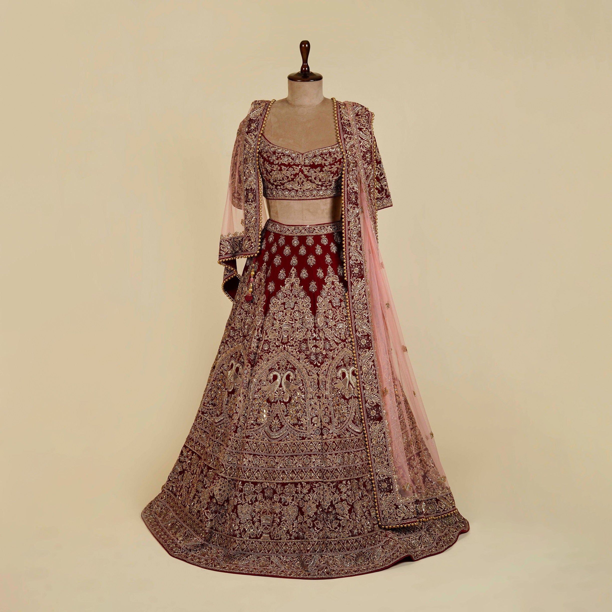 Maroon Lehenga Choli embellished with Dabka, Stone and antique hand work