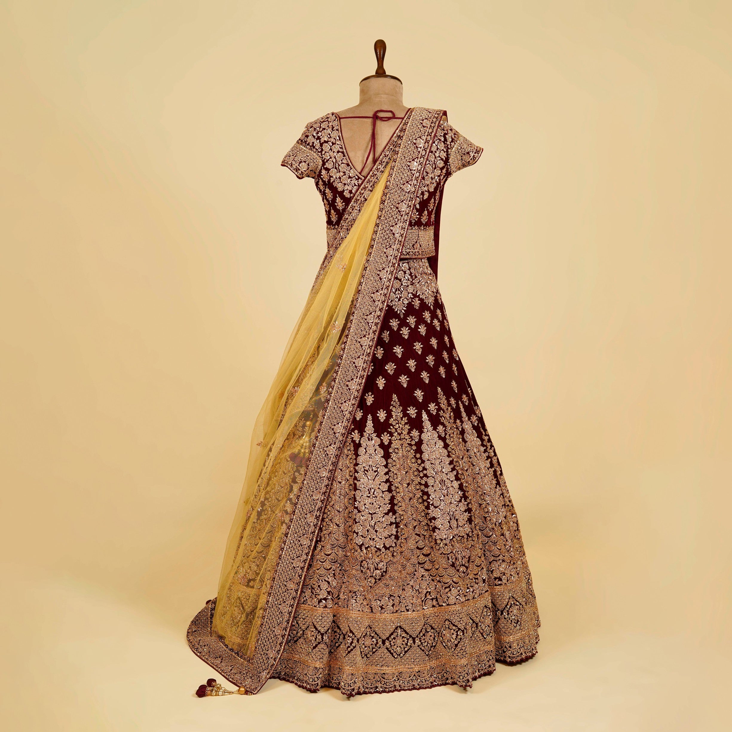 Maroon Wine Lehenga Choli embellished with Dabka, Stone and antique gold hand work