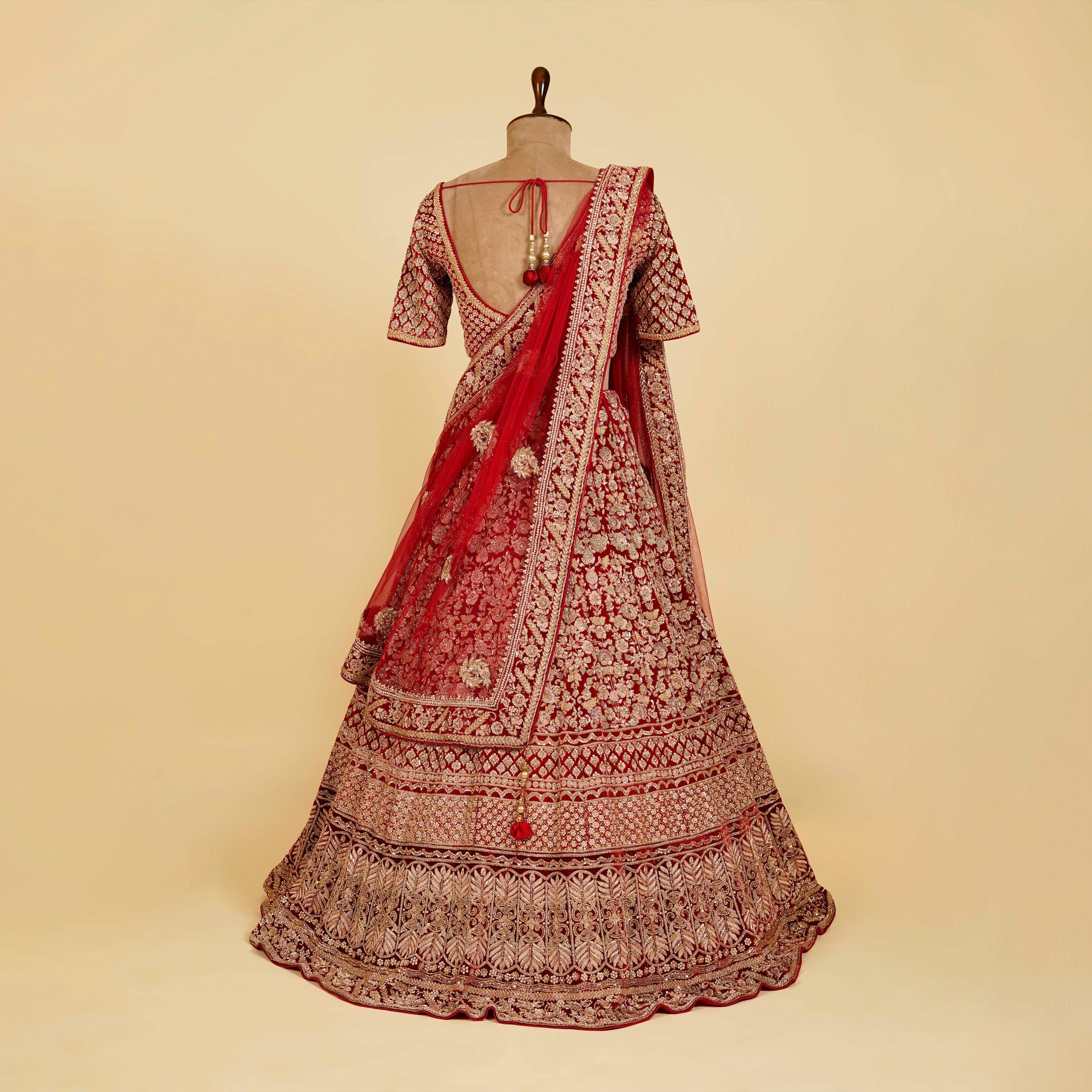 Red Lehenga Choli embellished with Dabka, Pearls and Cut Dana work