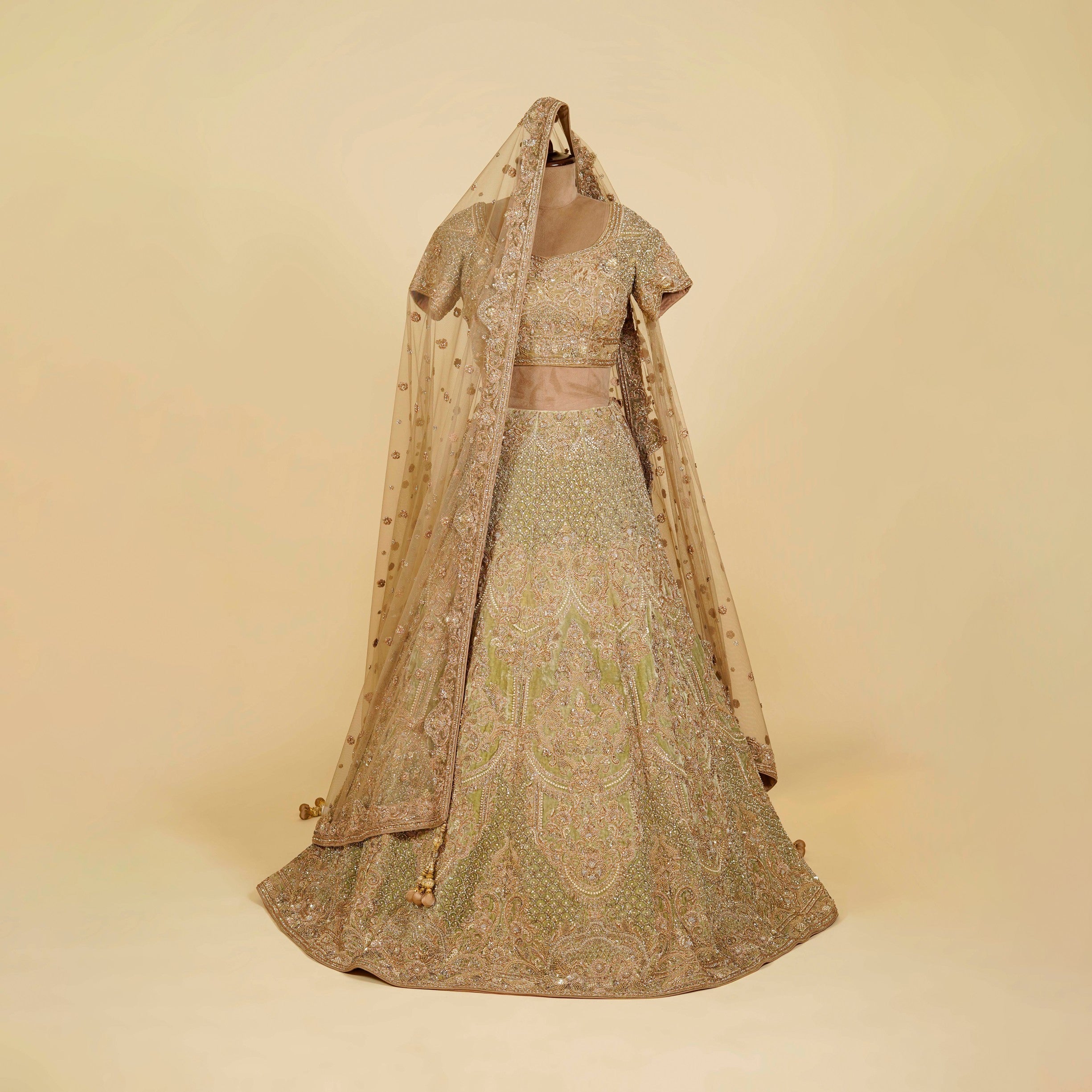 Green Lehenga Choli embellished with Dabka, Pearls and Stone work