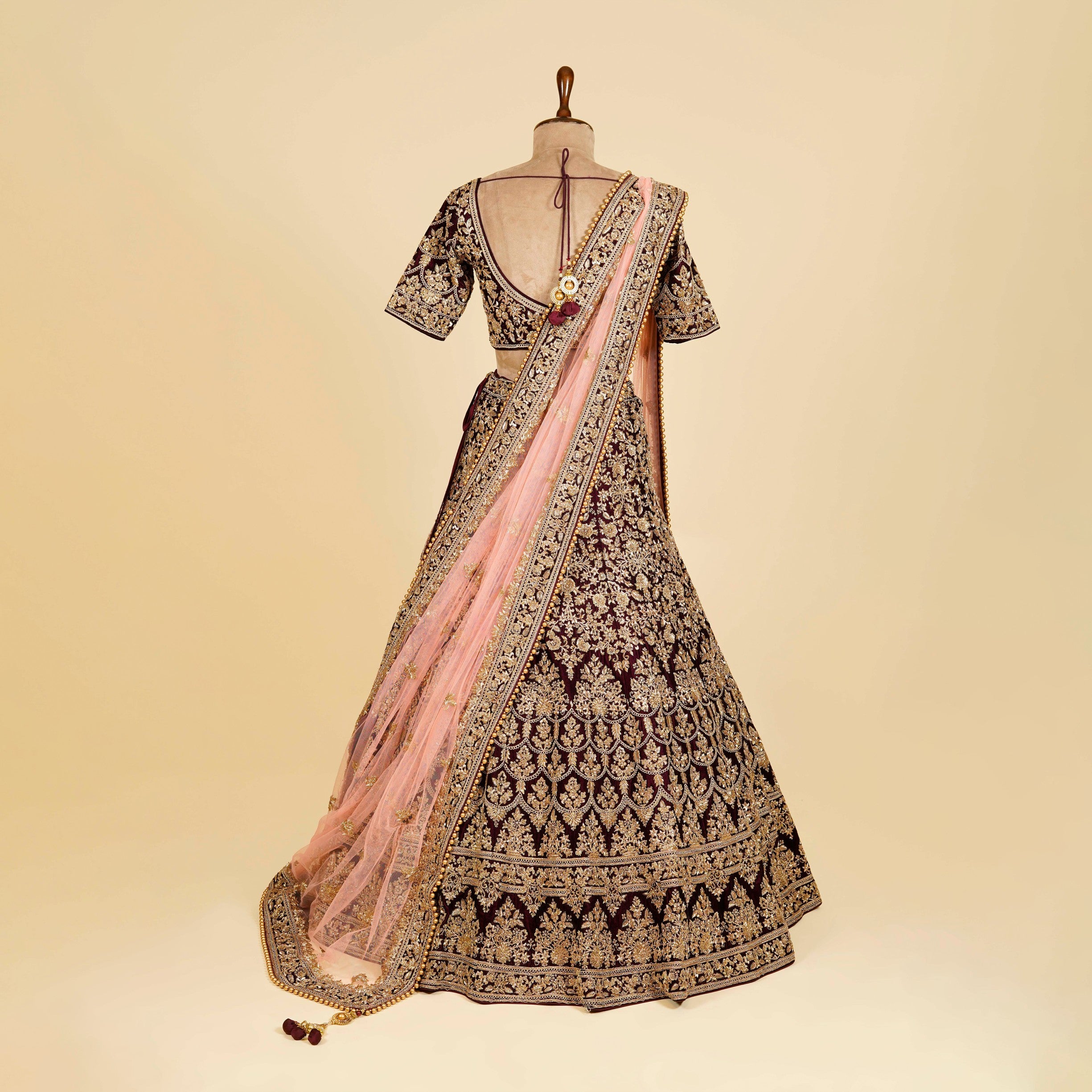 Dark Maroon Wine Lehenga Choli embellished with Dabka, Stone and Gold antique work