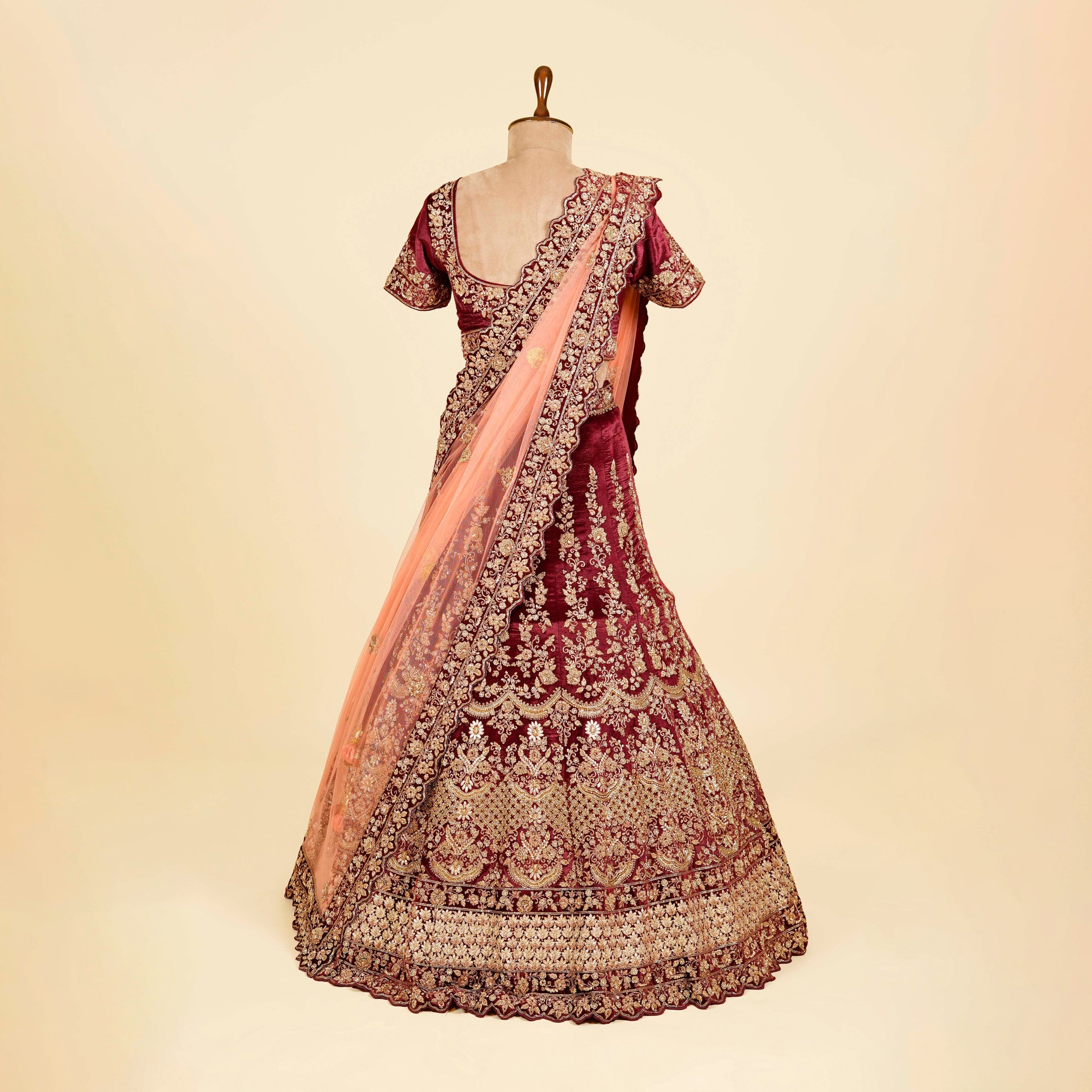 Maroon Lehenga Choli embellished with Dabka and Gota patti work