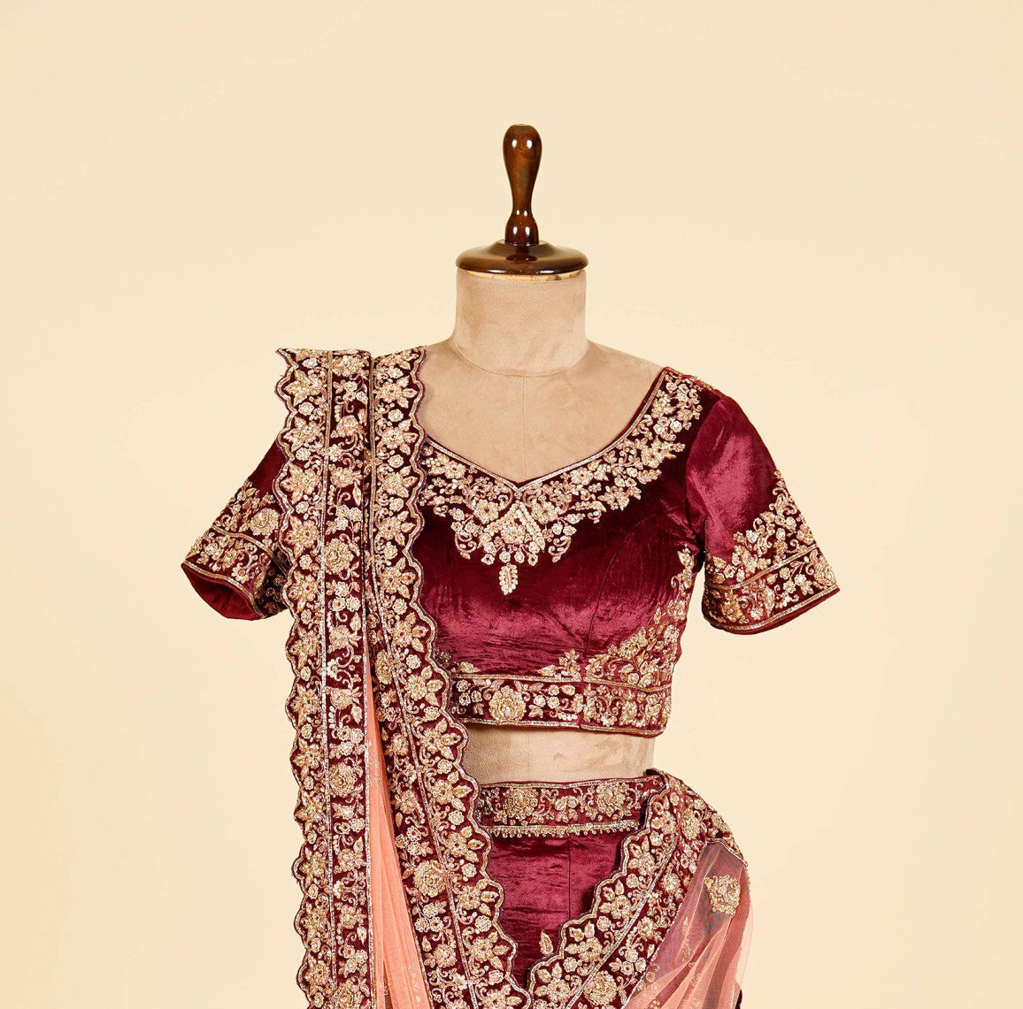 Maroon Lehenga Choli embellished with Dabka and Gota patti work