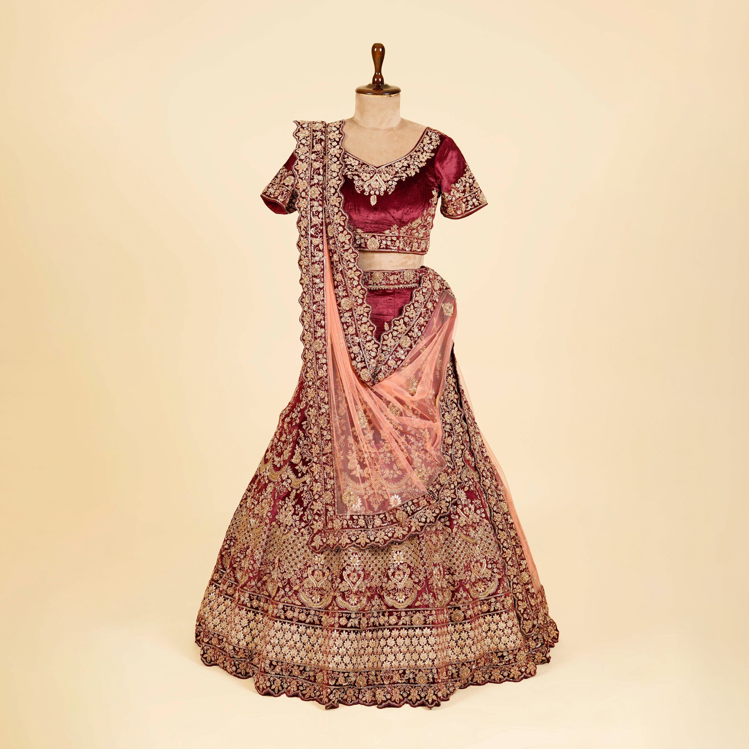 Maroon Lehenga Choli embellished with Dabka and Gota patti work