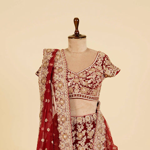 Reddish Maroon Lehenga Choli embellished with Dabka, Stone and antique work