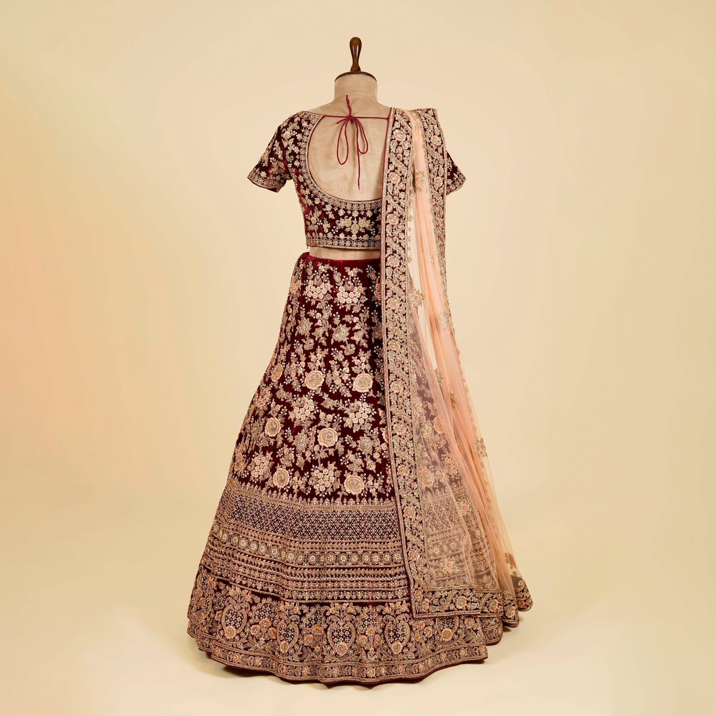 Maroon Lehenga Choli embellished with Dabka, Thread and antique work