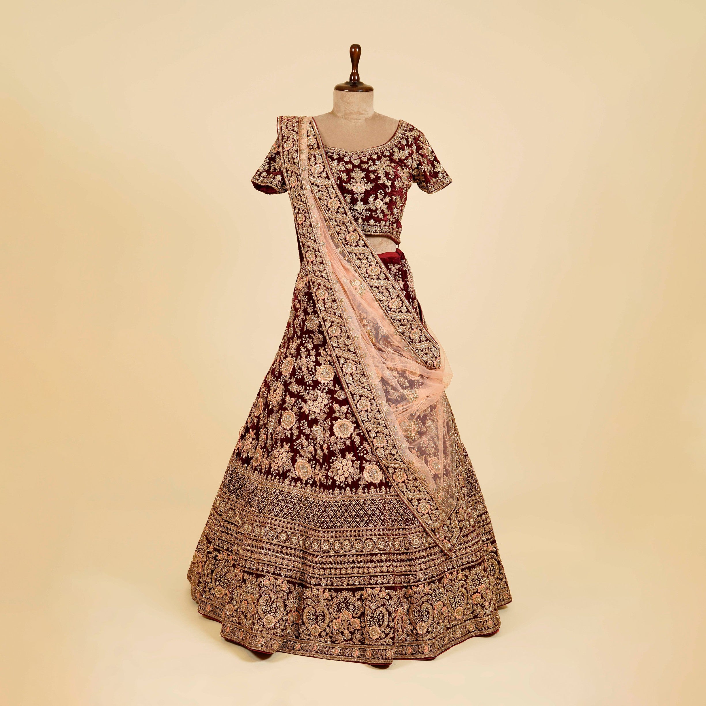 Maroon Lehenga Choli embellished with Dabka, Thread and antique work