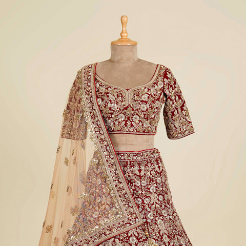 Reddish Maroon Lehenga Choli embellished with Zardosi, Gota patti and Dori work