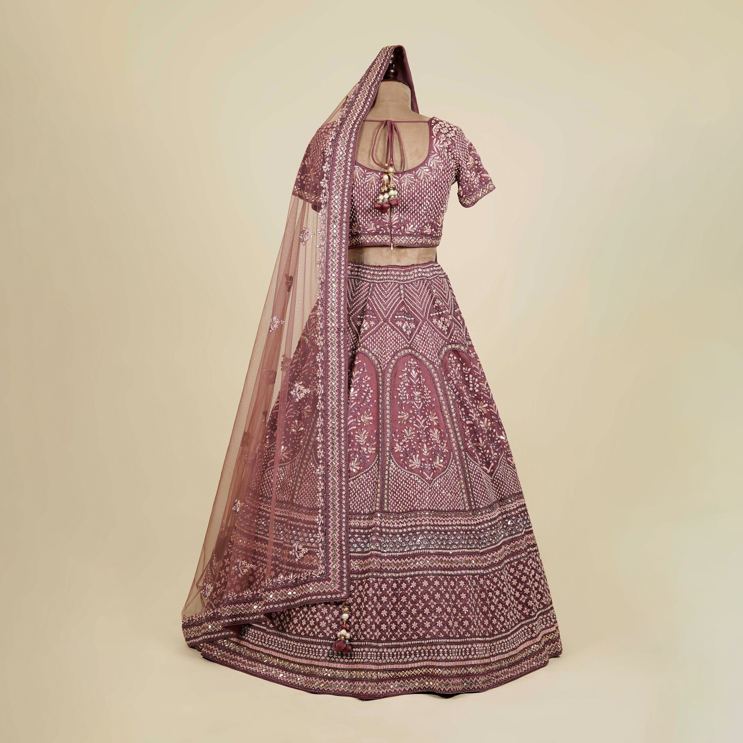 Onion color Lehenga Choli embellished with Zardosi, Dabka and Mukaish work